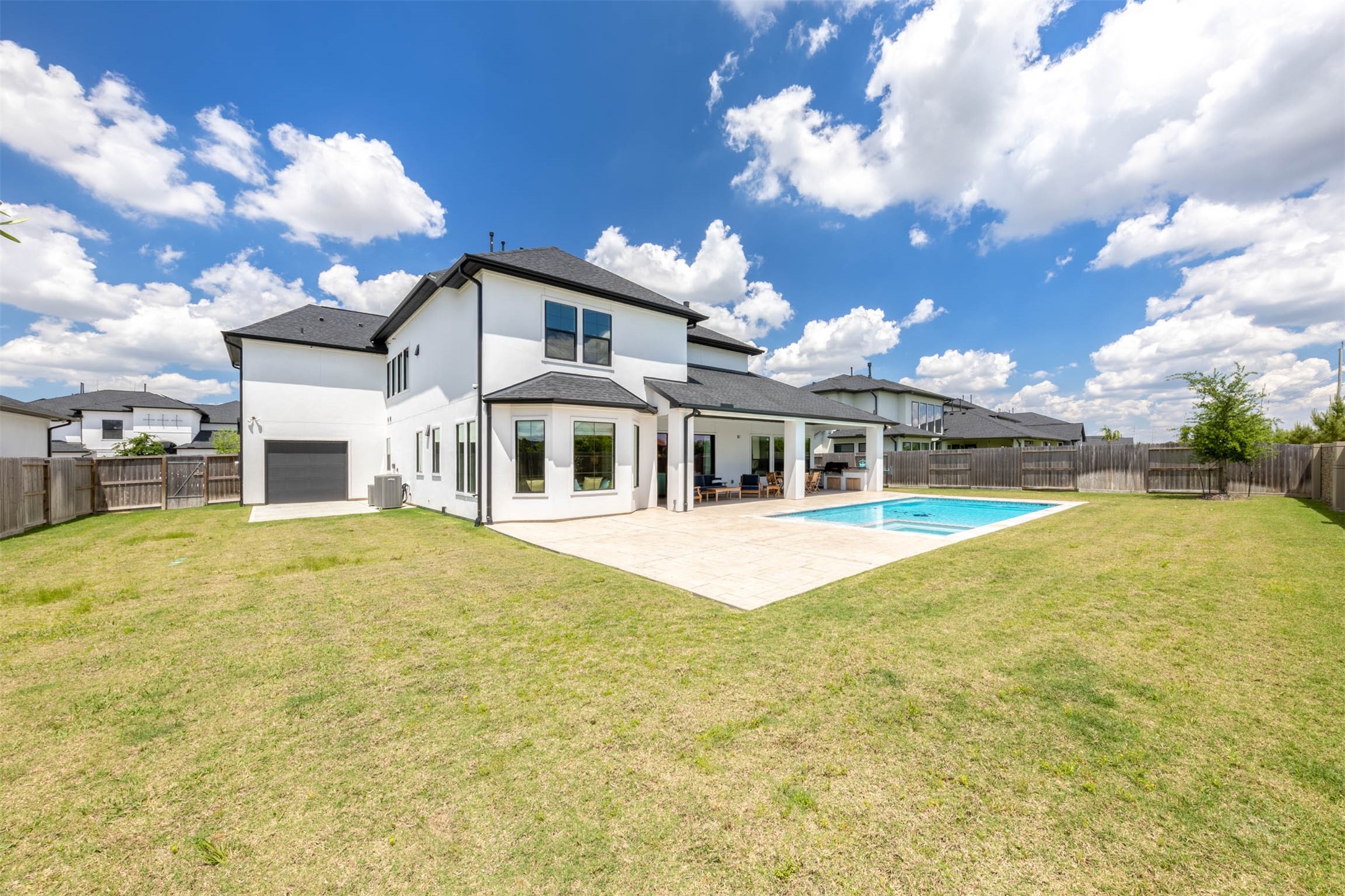 27919 Indigo Ridge Drive Fulshear, TX 77441 - Photo 47 of 50 a front view of house with yard and swimming pool