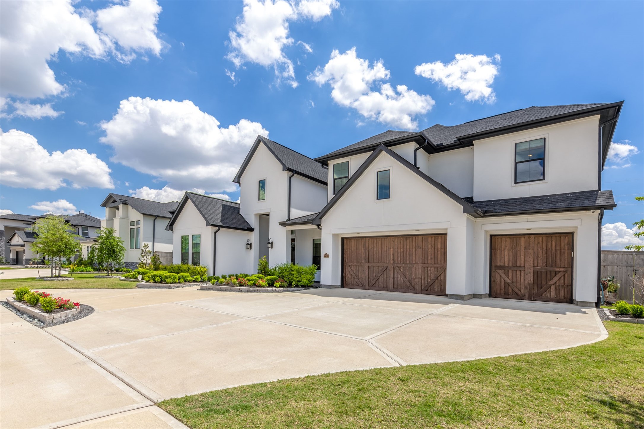 27919 Indigo Ridge Drive Fulshear, TX 77441 - Photo 49 of 50 a front view of a house with a yard and a garage