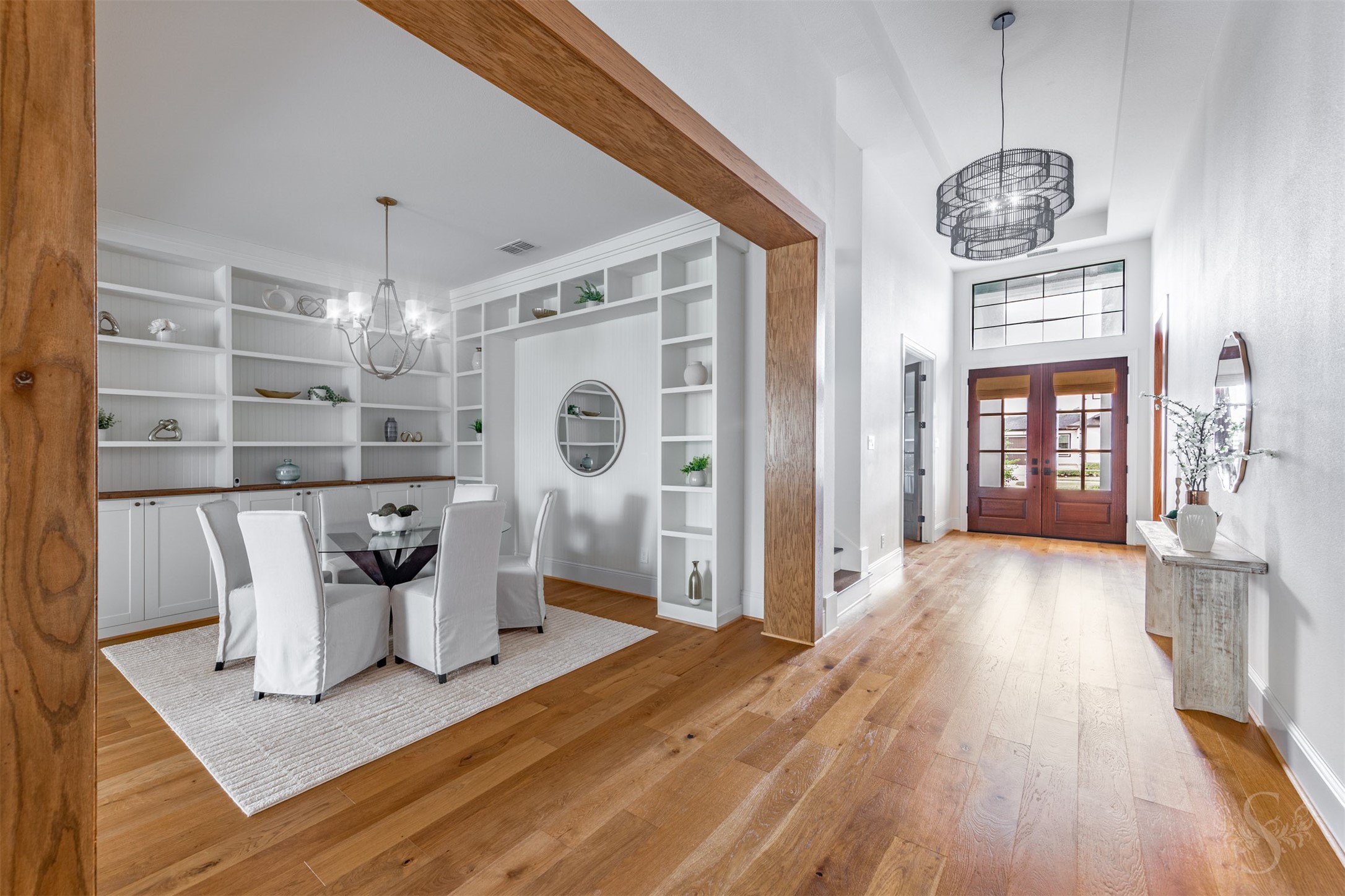 27919 Indigo Ridge Drive Fulshear, TX 77441 - Photo 10 of 50 a view of a dining room with furniture wooden floor and chandelier