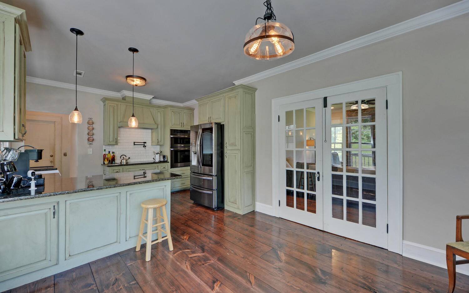 20 Emory Shield Road Murphy, NC 28906 - Photo 8 of 55 a kitchen with stainless steel appliances kitchen island a refrigerator and a wooden floors