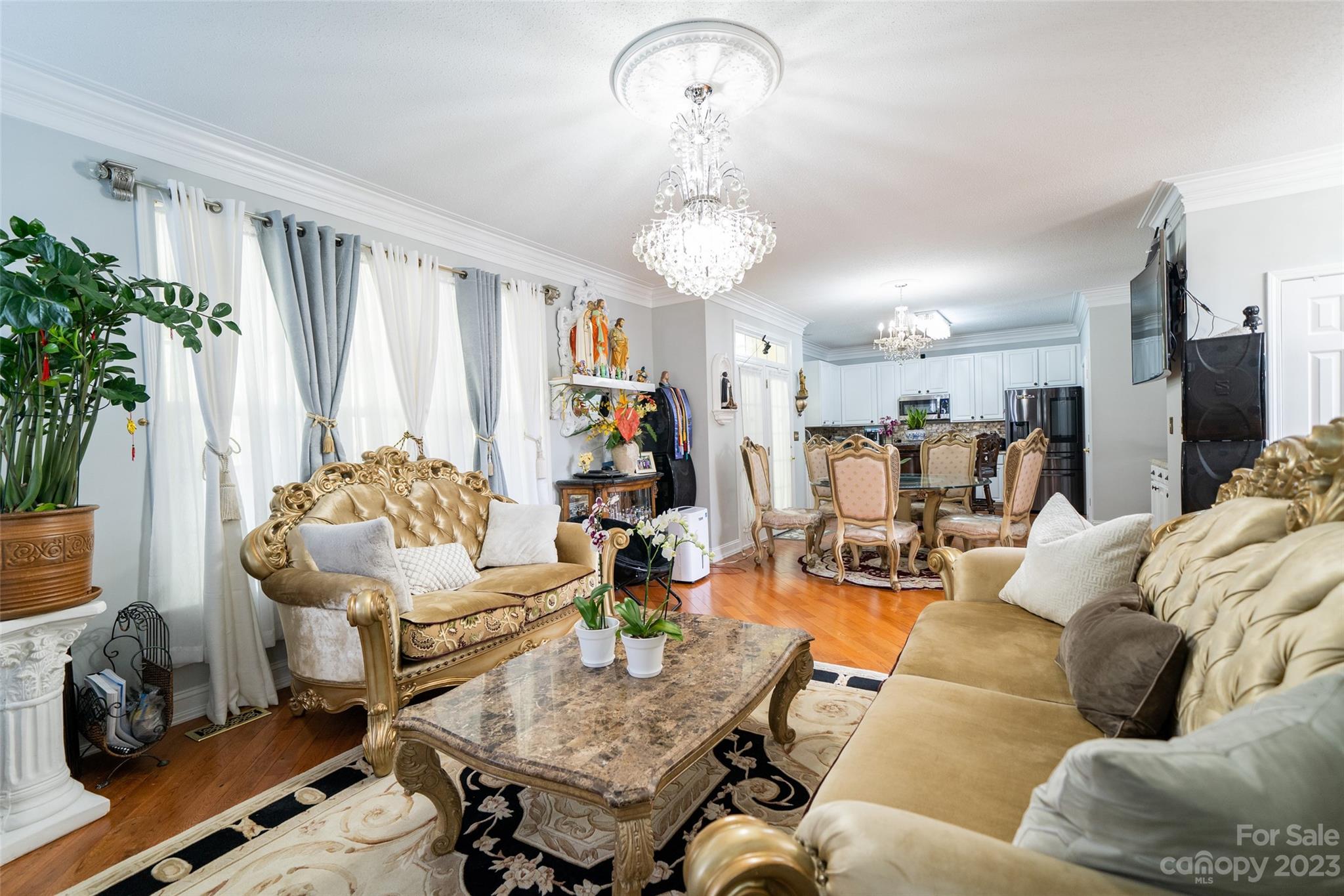 67 Walnut Crest Road Fletcher, NC 28732 - Photo 11 of 36 a living room with furniture and a chandelier