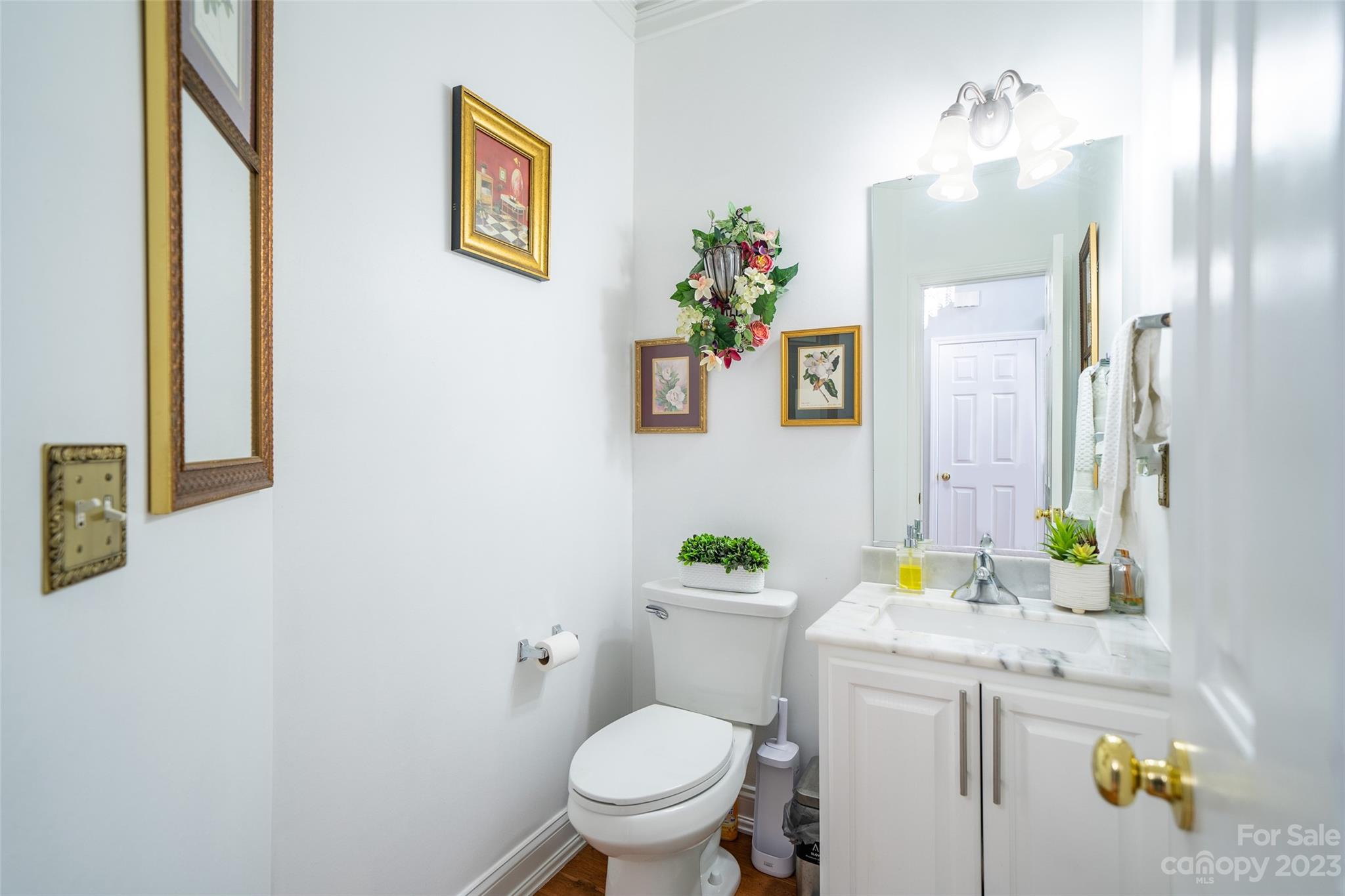 67 Walnut Crest Road Fletcher, NC 28732 - Photo 16 of 36 a bathroom with a toilet sink and mirror