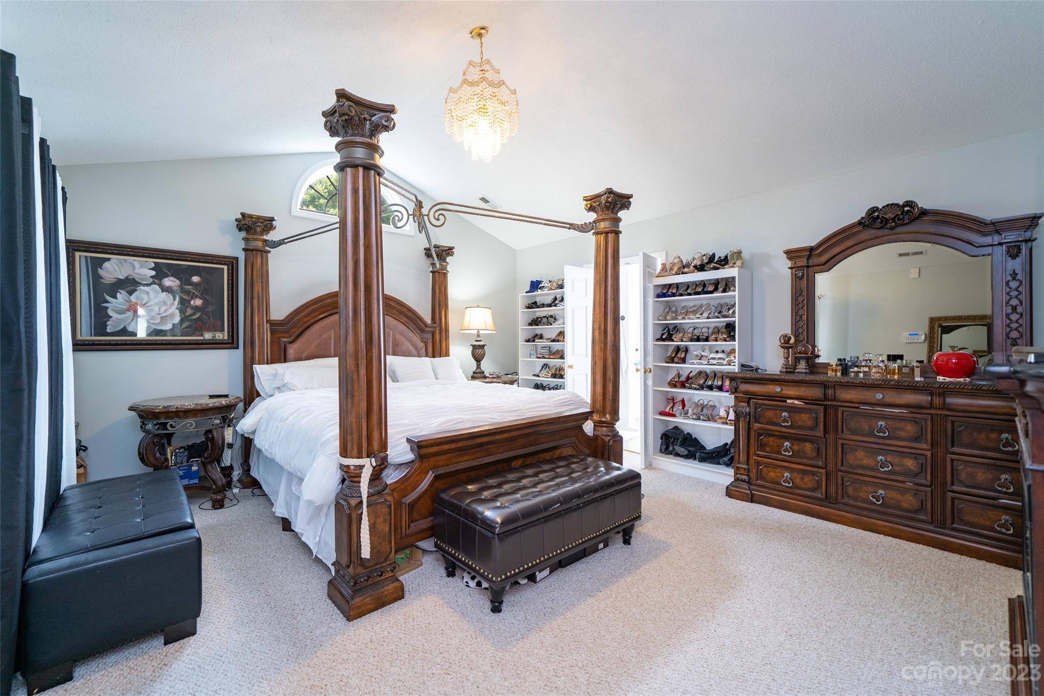 67 Walnut Crest Road Fletcher, NC 28732 - Photo 18 of 36 a spacious bedroom with a bed a dresser and book shelf