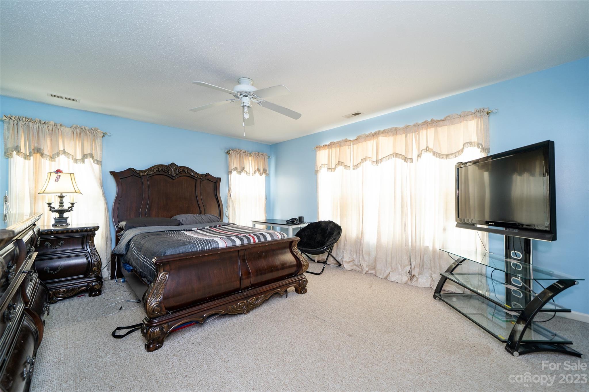 67 Walnut Crest Road Fletcher, NC 28732 - Photo 20 of 36 a bedroom with furniture and a flat screen tv