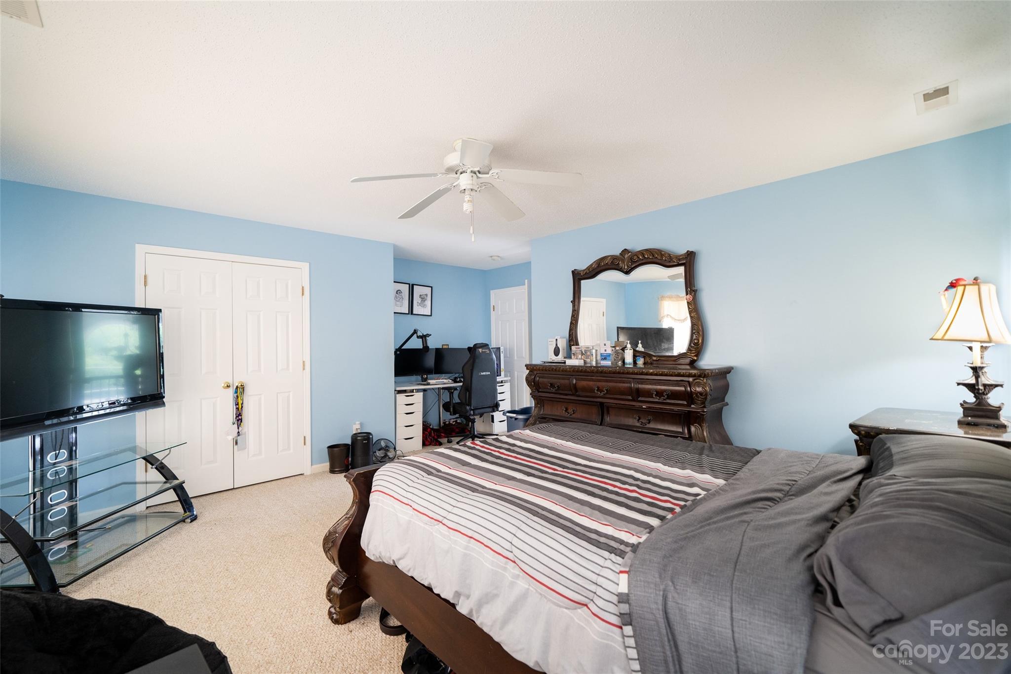 67 Walnut Crest Road Fletcher, NC 28732 - Photo 21 of 36 a bedroom with a bed and a flat screen tv