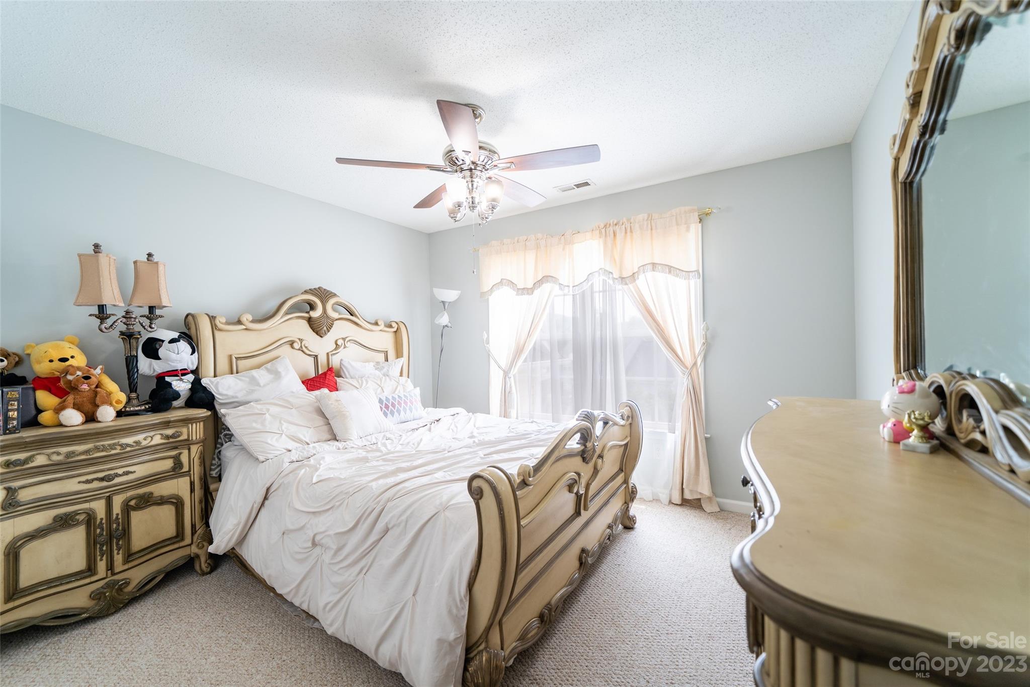 67 Walnut Crest Road Fletcher, NC 28732 - Photo 22 of 36 a bedroom with a bed and a chandelier