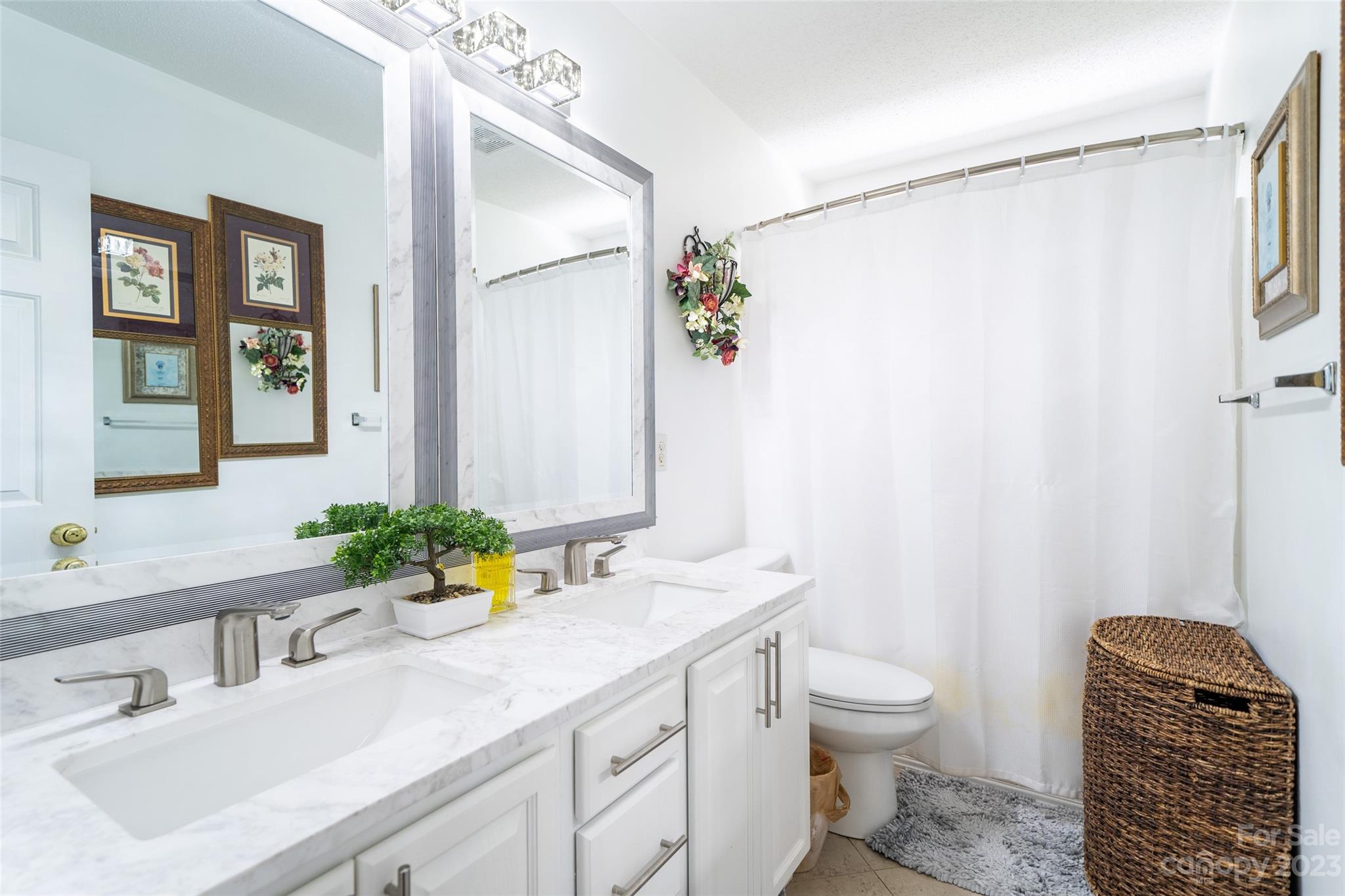 67 Walnut Crest Road Fletcher, NC 28732 - Photo 25 of 36 a bathroom with a granite countertop sink a toilet and shower