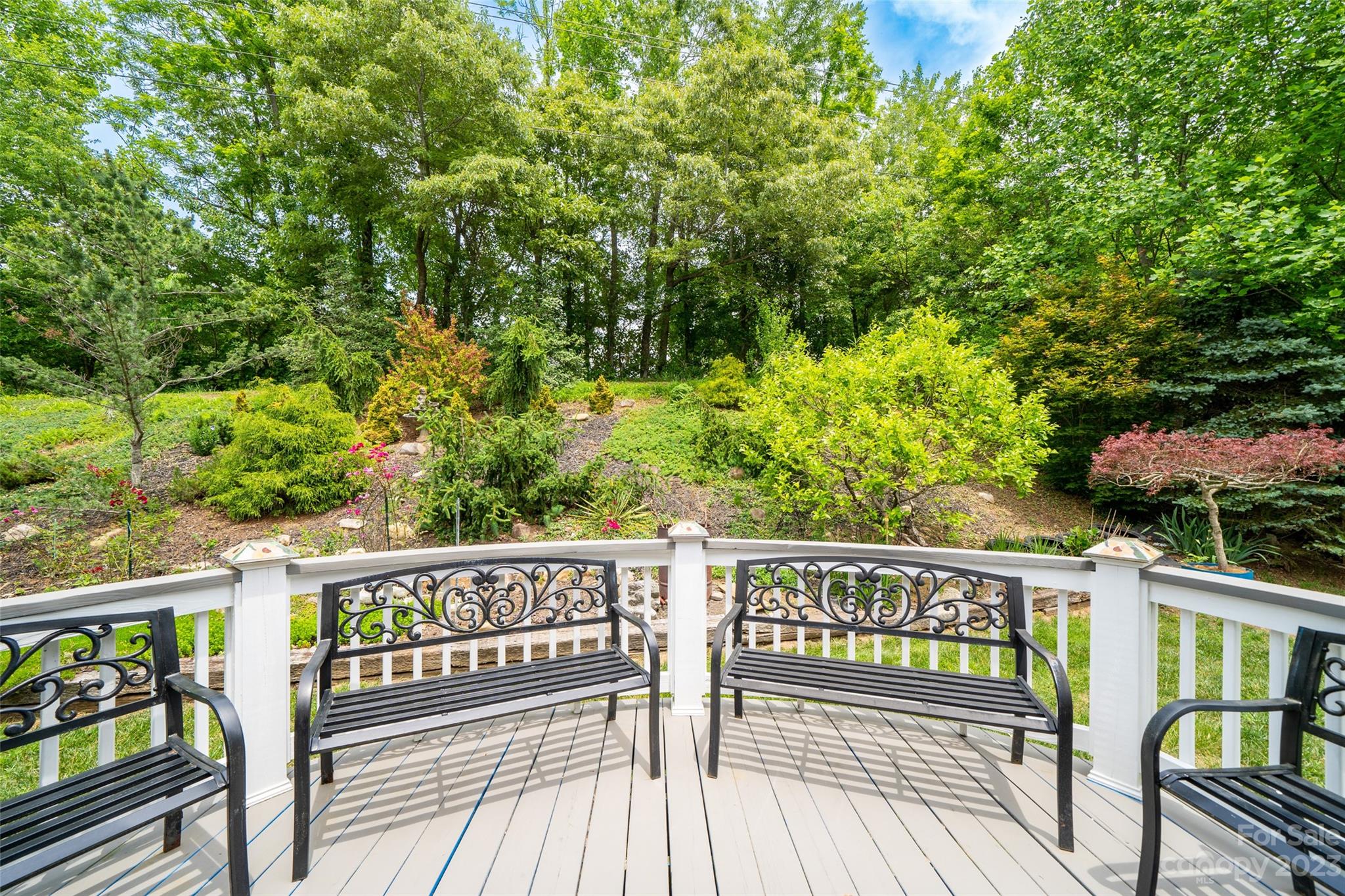 67 Walnut Crest Road Fletcher, NC 28732 - Photo 28 of 36 a view of a wooden deck with a large garden