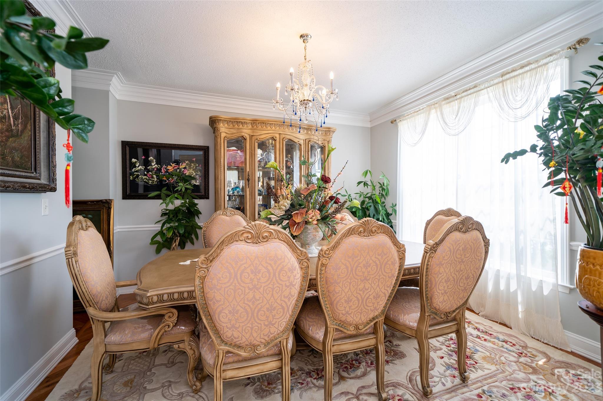67 Walnut Crest Road Fletcher, NC 28732 - Photo 7 of 36 a dining room with furniture a large window and wooden floor