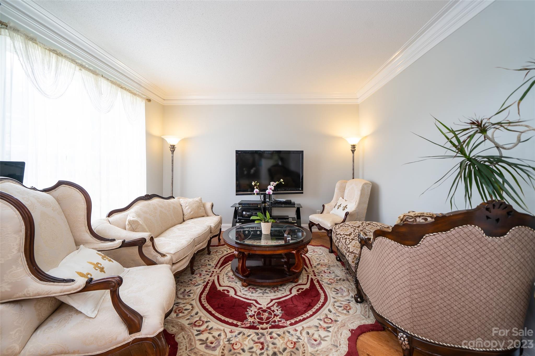 67 Walnut Crest Road Fletcher, NC 28732 - Photo 8 of 36 a living room with furniture and a flat screen tv