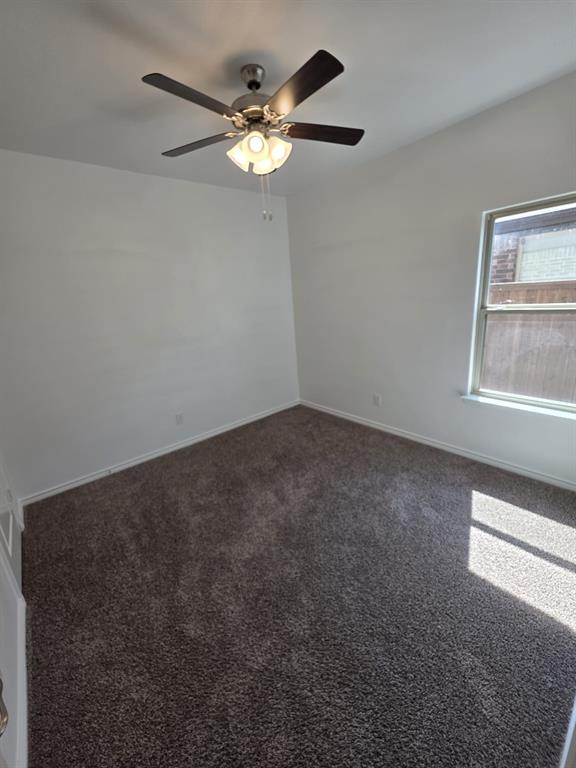 2126 Hobby Drive Forney, TX 75126 - Photo 14 of 28 Spare room with dark colored carpet and baseboards
