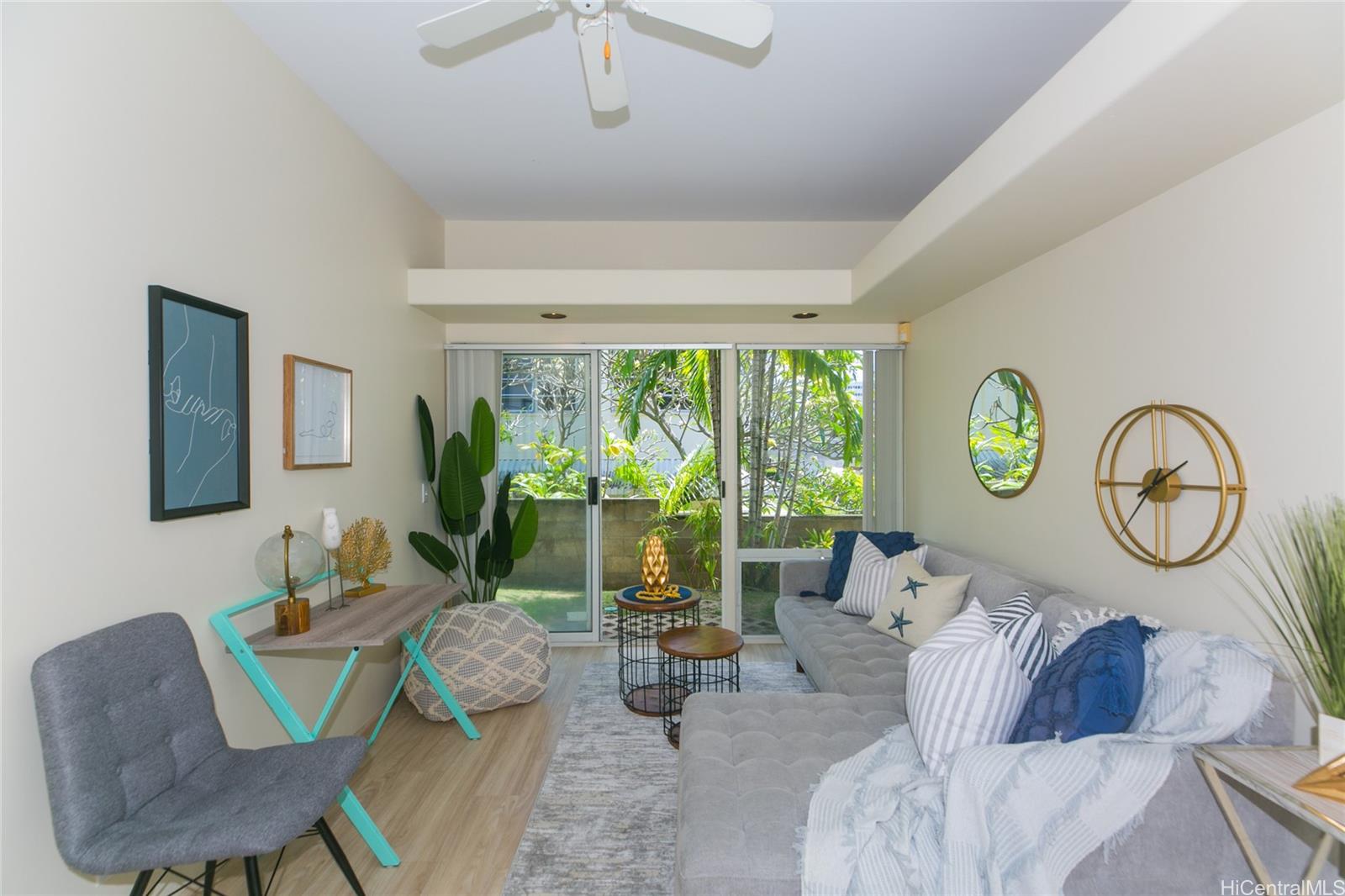 1329 B Dominis Street, Unit B Honolulu, HI 96822 - Photo 1 of 1 a living room with furniture and a large window