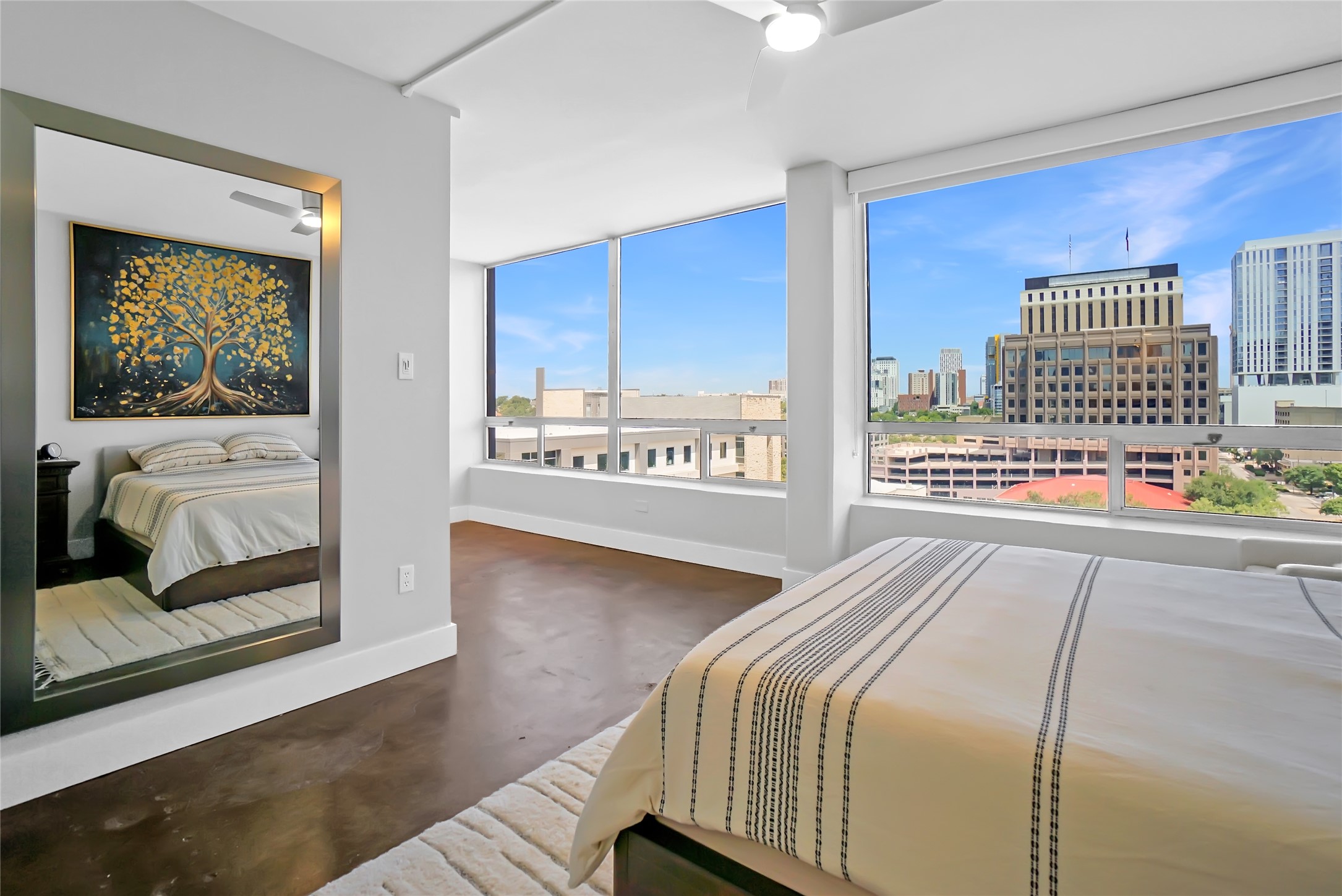 1212 Guadalupe Street, Unit 1004 Austin, TX 78701 - Photo 21 of 33 a bedroom with a bed and a window