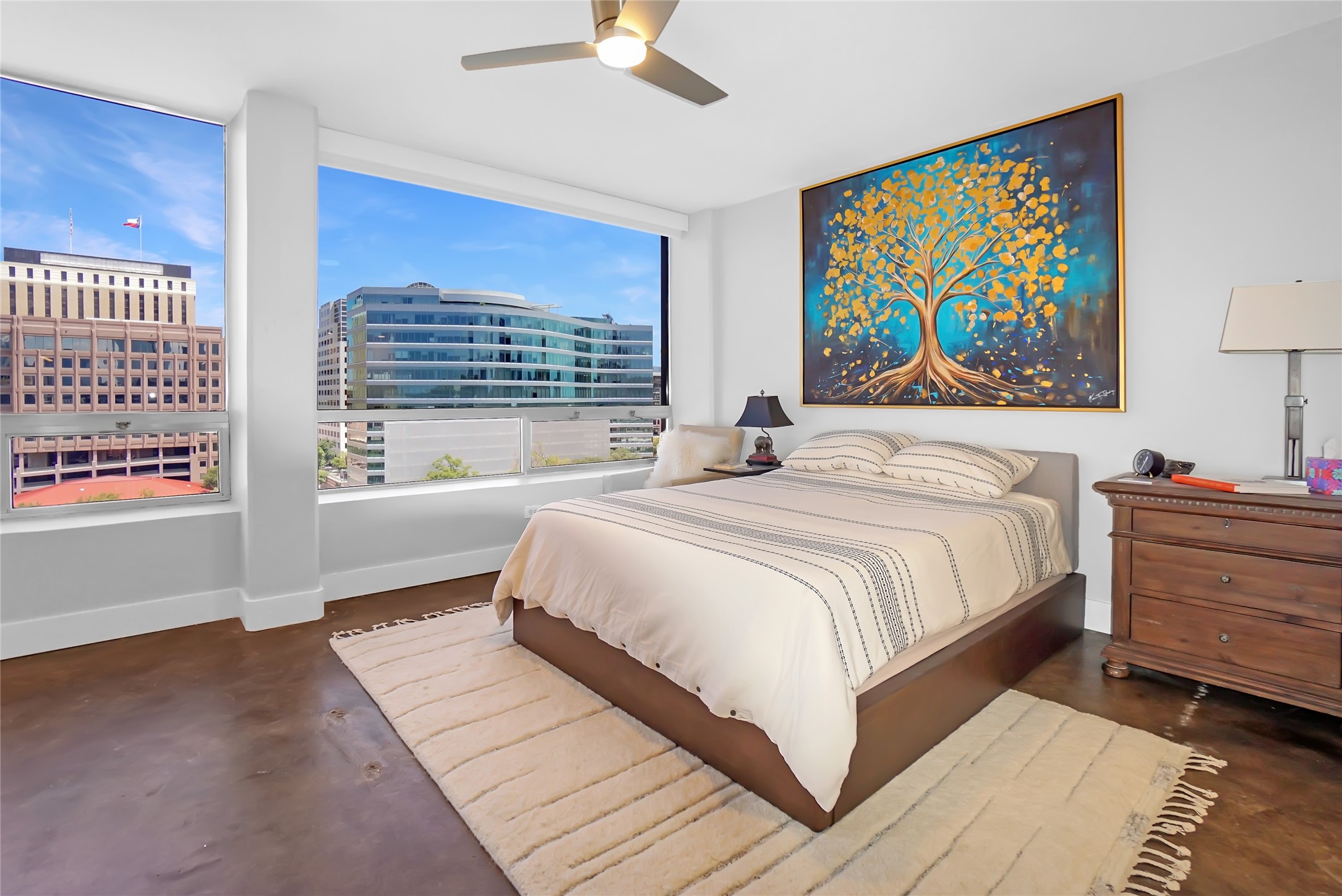 1212 Guadalupe Street, Unit 1004 Austin, TX 78701 - Photo 22 of 33 a bedroom with a bed and a window