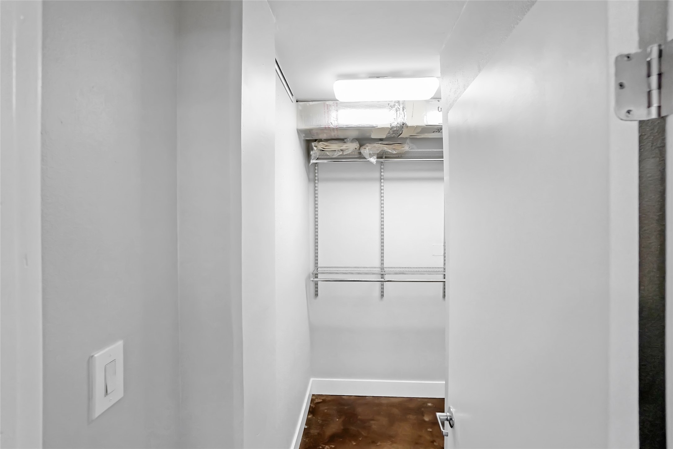 1212 Guadalupe Street, Unit 1004 Austin, TX 78701 - Photo 27 of 33 a walk in closet with a mirror