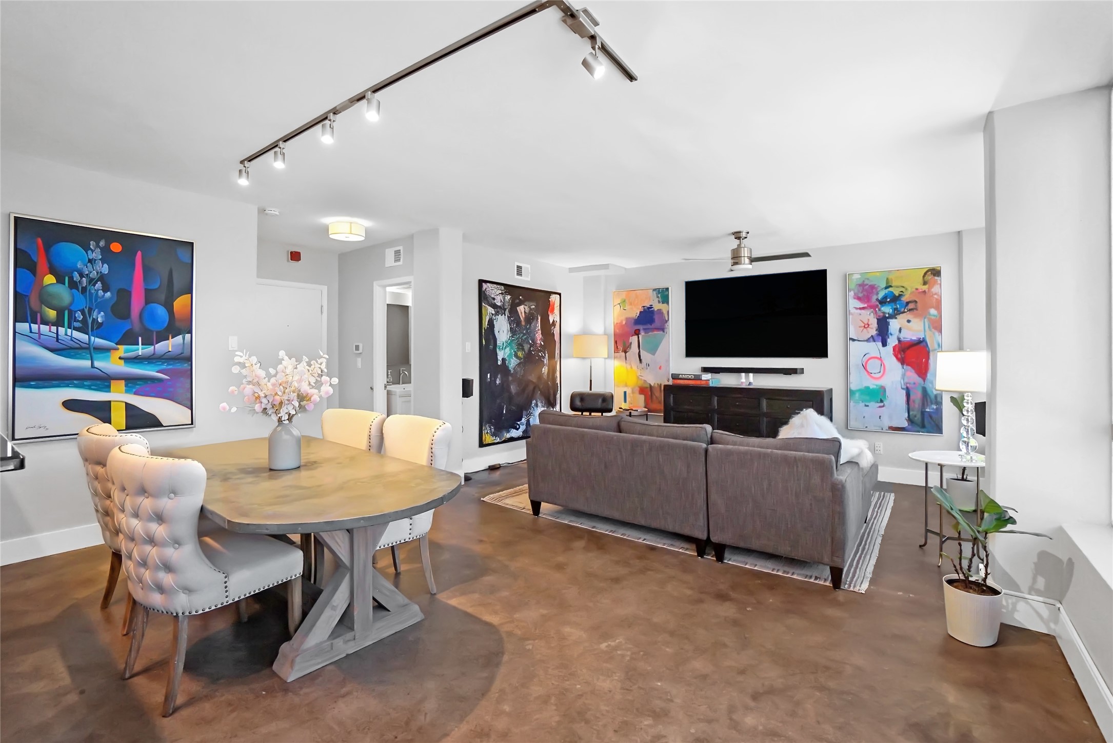 1212 Guadalupe Street, Unit 1004 Austin, TX 78701 - Photo 9 of 33 a living room with furniture and a flat screen tv