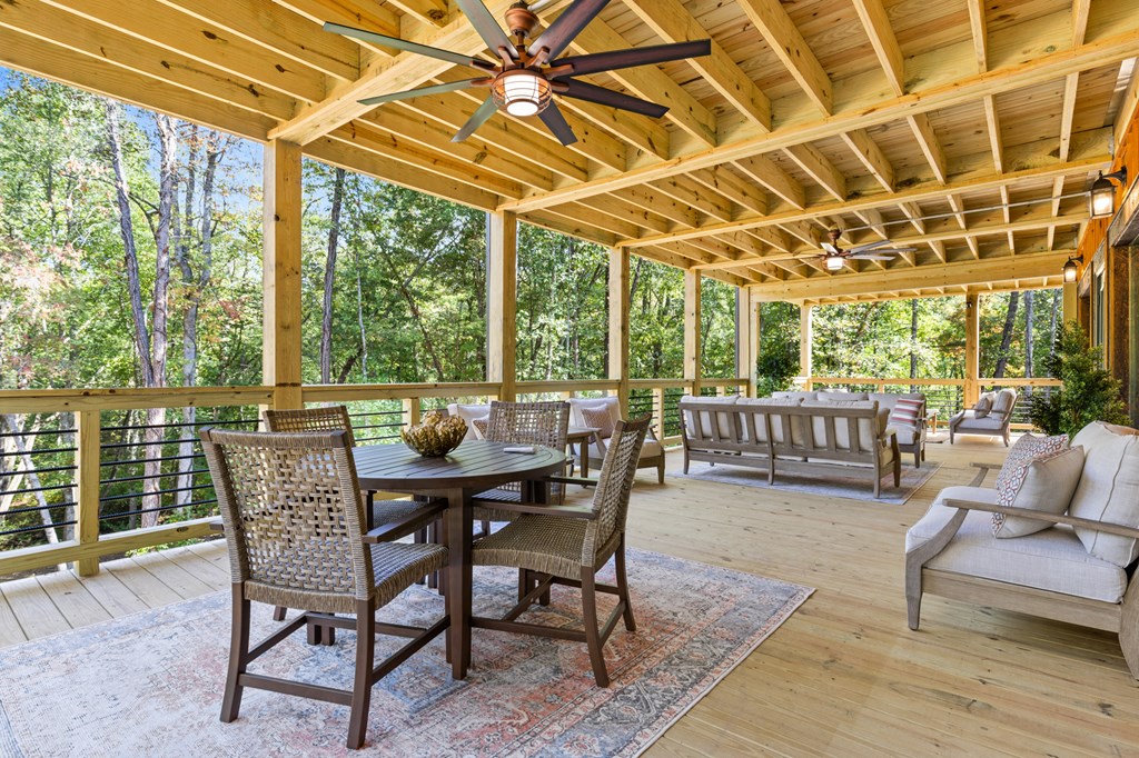 245 East Shalom Court Blue Ridge, GA 30513 - Photo 48 of 78 a view of a patio with a table and chairs