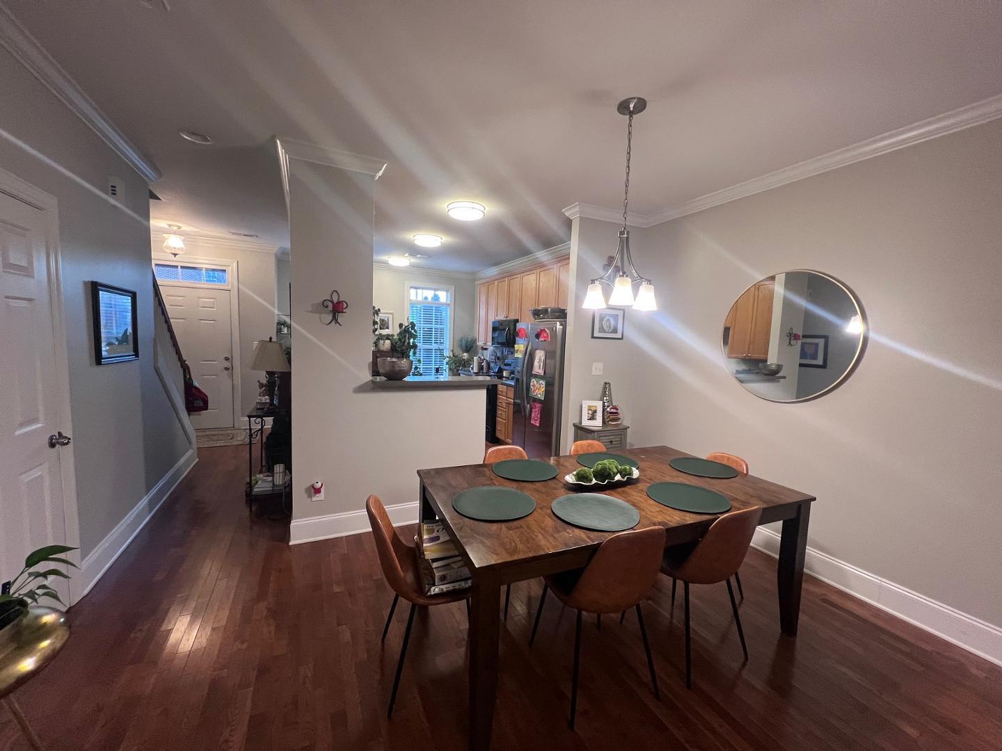 655 Highpark Lane Raleigh, NC 27608 - Photo 3 of 12 a view of a dining room with furniture and wooden floor