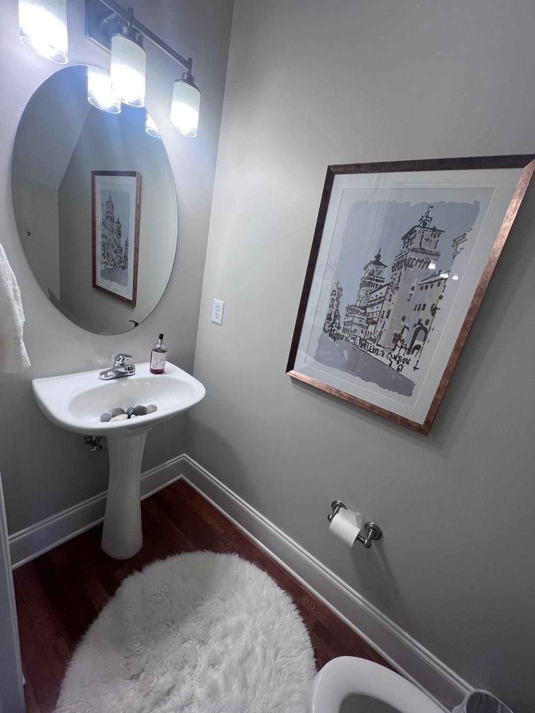 655 Highpark Lane Raleigh, NC 27608 - Photo 9 of 12 a bathroom with a sink and a mirror
