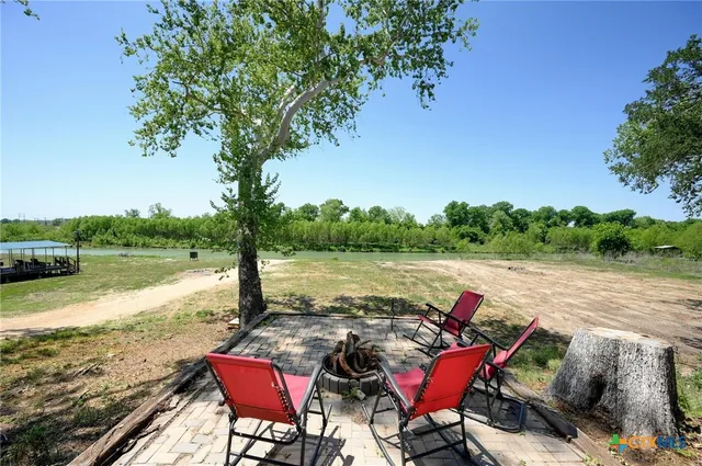 a view of a backyard with swimming pool