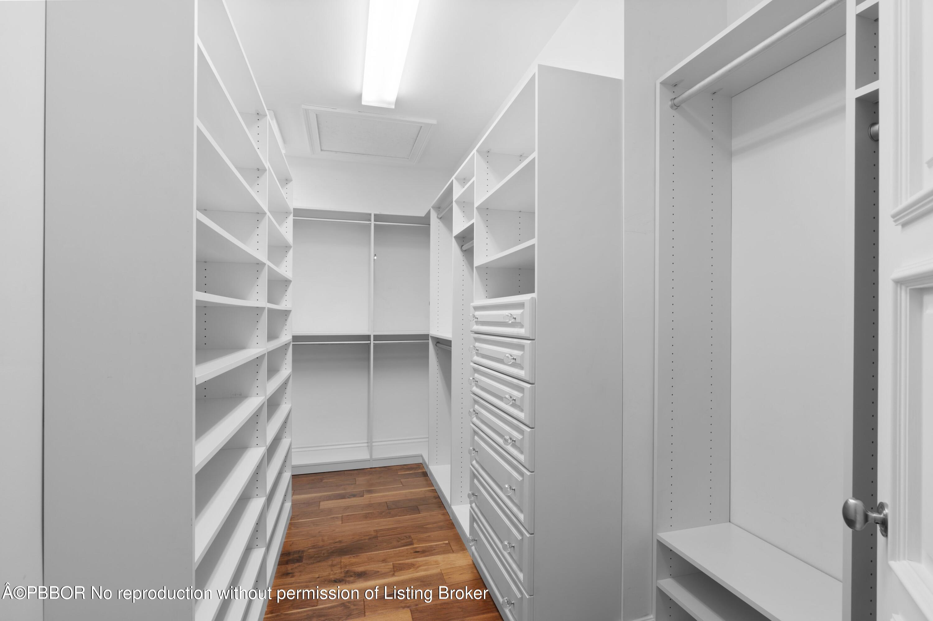 265 List Road Palm Beach, FL 33480 - Photo 16 of 26 a view of walk in closet with empty racks