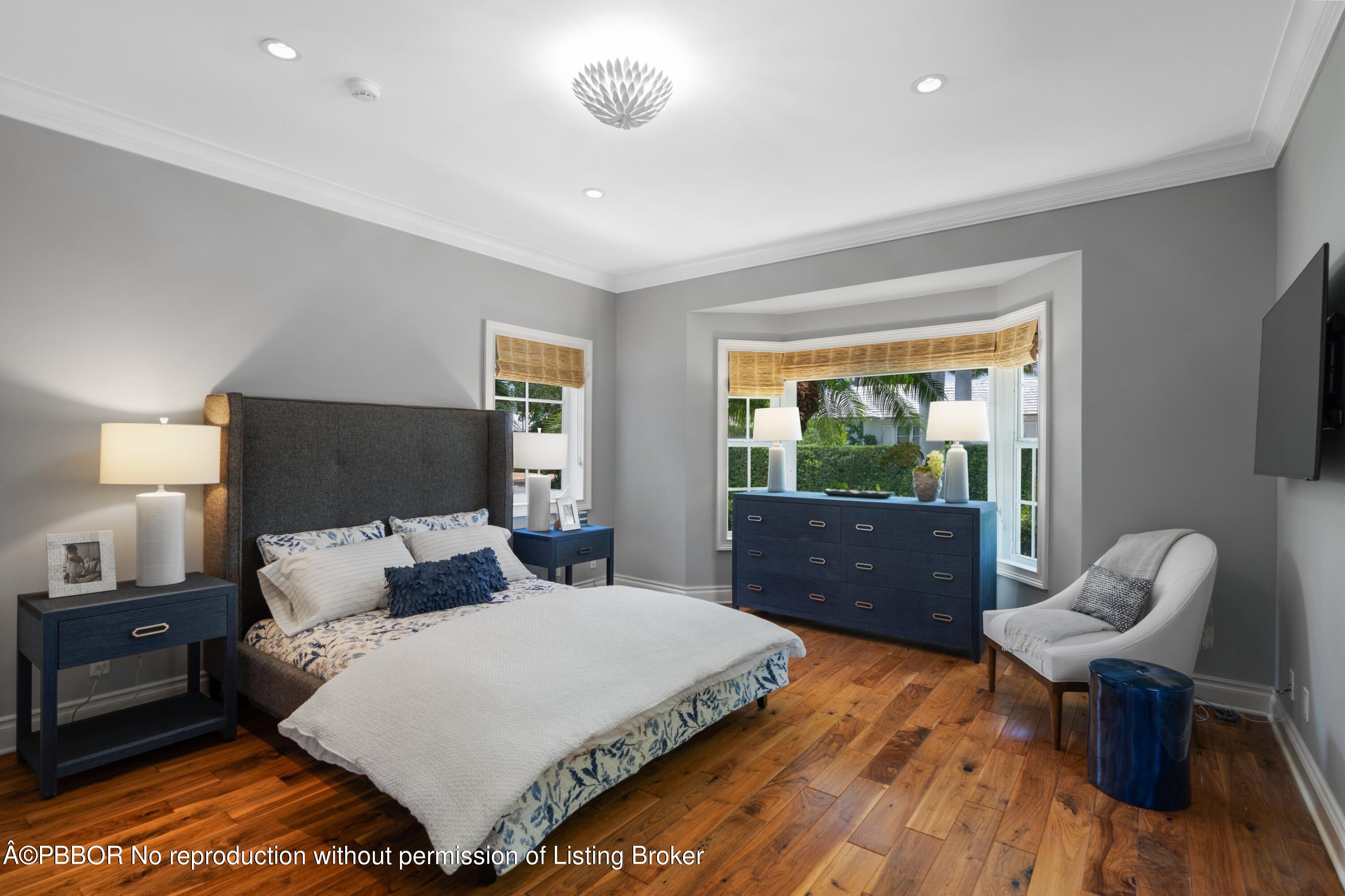 265 List Road Palm Beach, FL 33480 - Photo 17 of 26 a bedroom with a bed and a chair