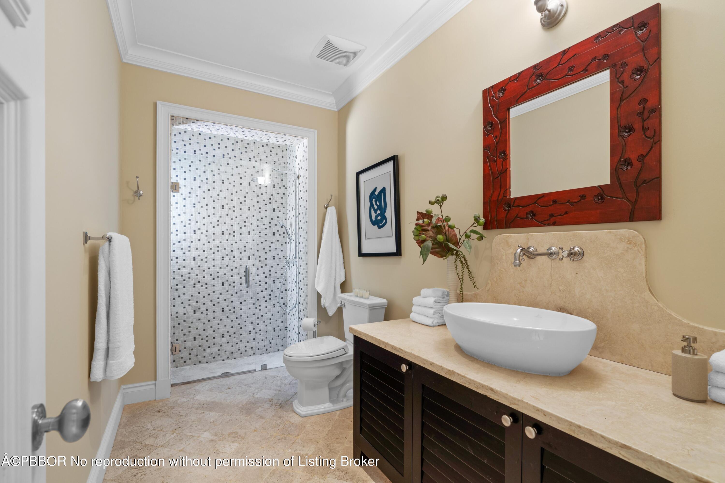 265 List Road Palm Beach, FL 33480 - Photo 20 of 26 a bathroom with a sink a toilet and shower