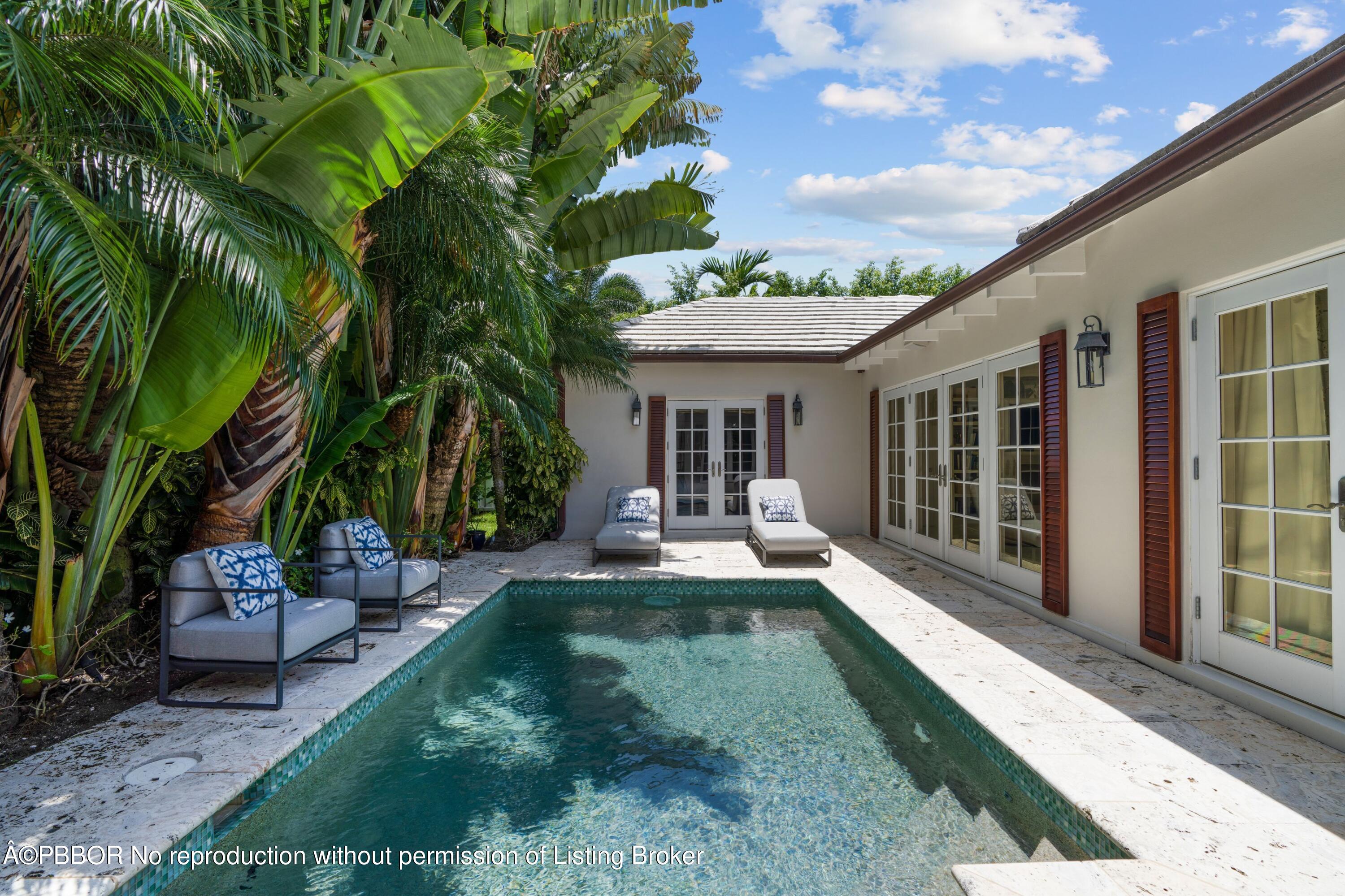 265 List Road Palm Beach, FL 33480 - Photo 22 of 26 a view of a house with backyard and sitting area