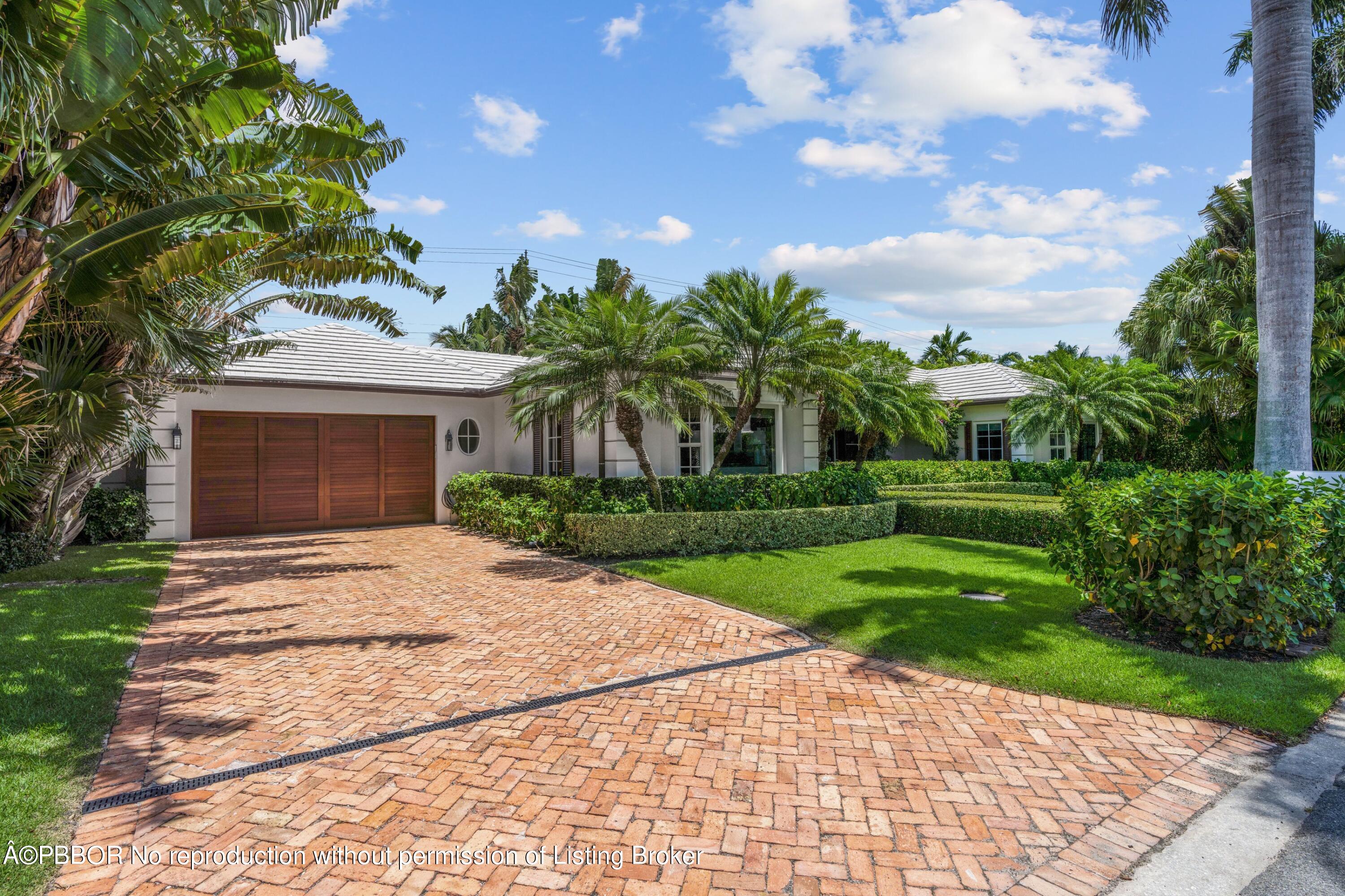265 List Road Palm Beach, FL 33480 - Photo 3 of 26 a front view of a house with garden