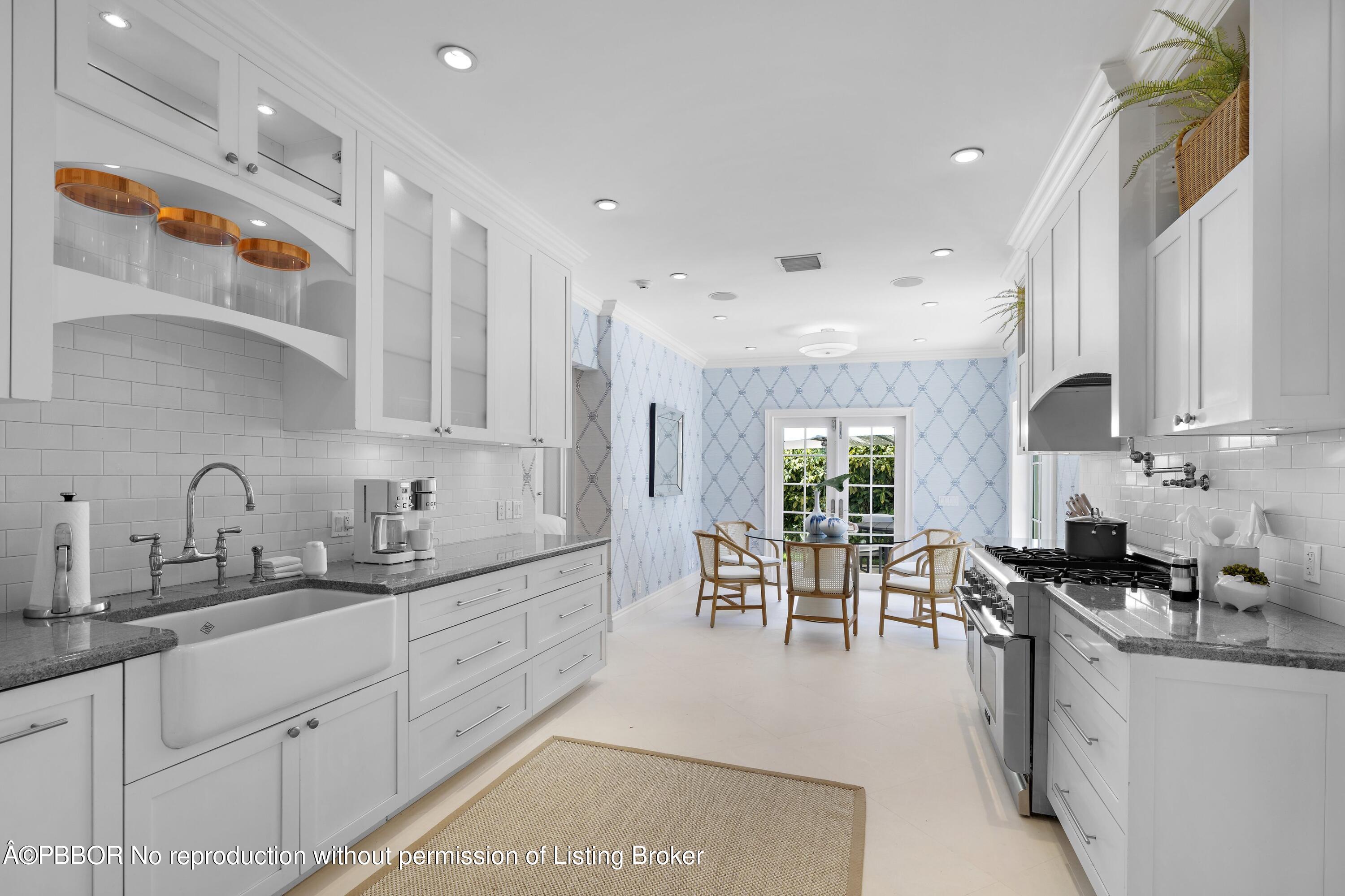 265 List Road Palm Beach, FL 33480 - Photo 10 of 26 a kitchen with appliances a sink and cabinets