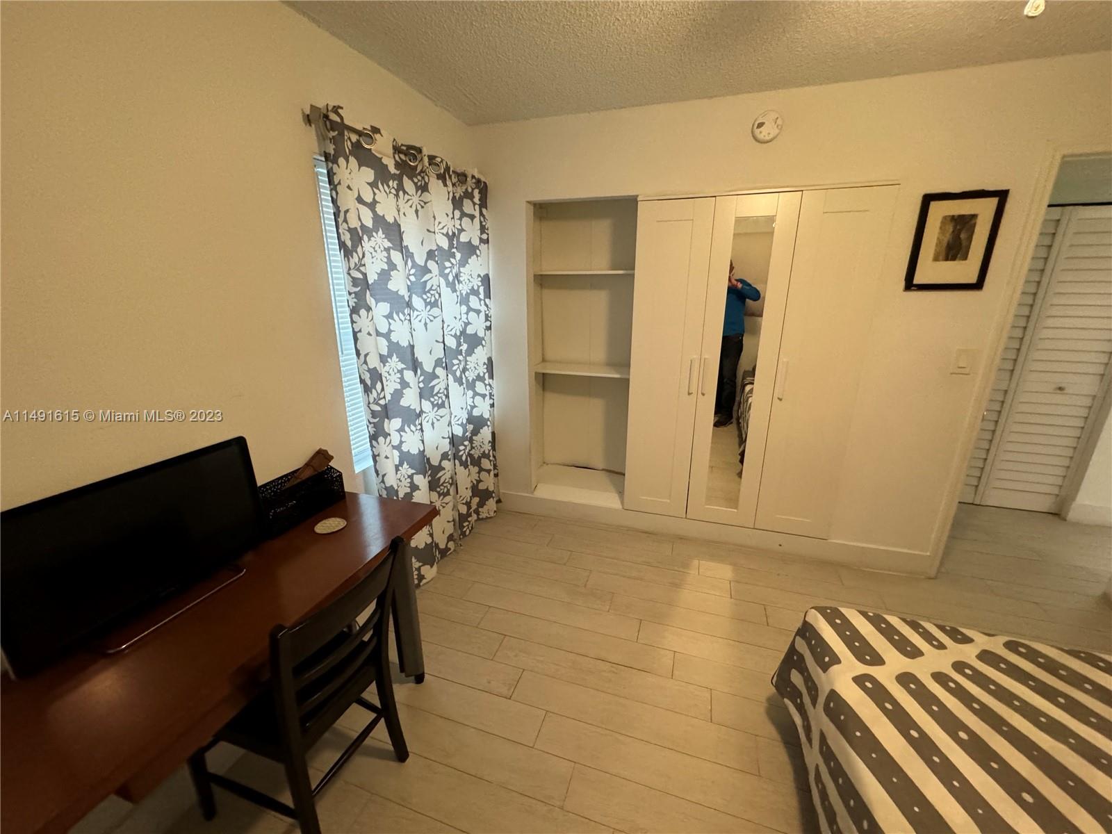 427 Southwest 7th Street, Unit 15 Miami, FL 33130 - Photo 21 of 25 a view of a workspace with furniture