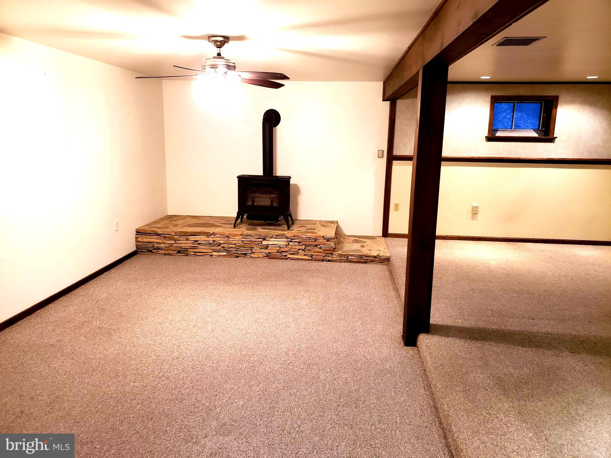 450 Church Lane Road Reading, PA 19606 - Photo 11 of 16 Finished basement-slate stone area f/p pot-belly