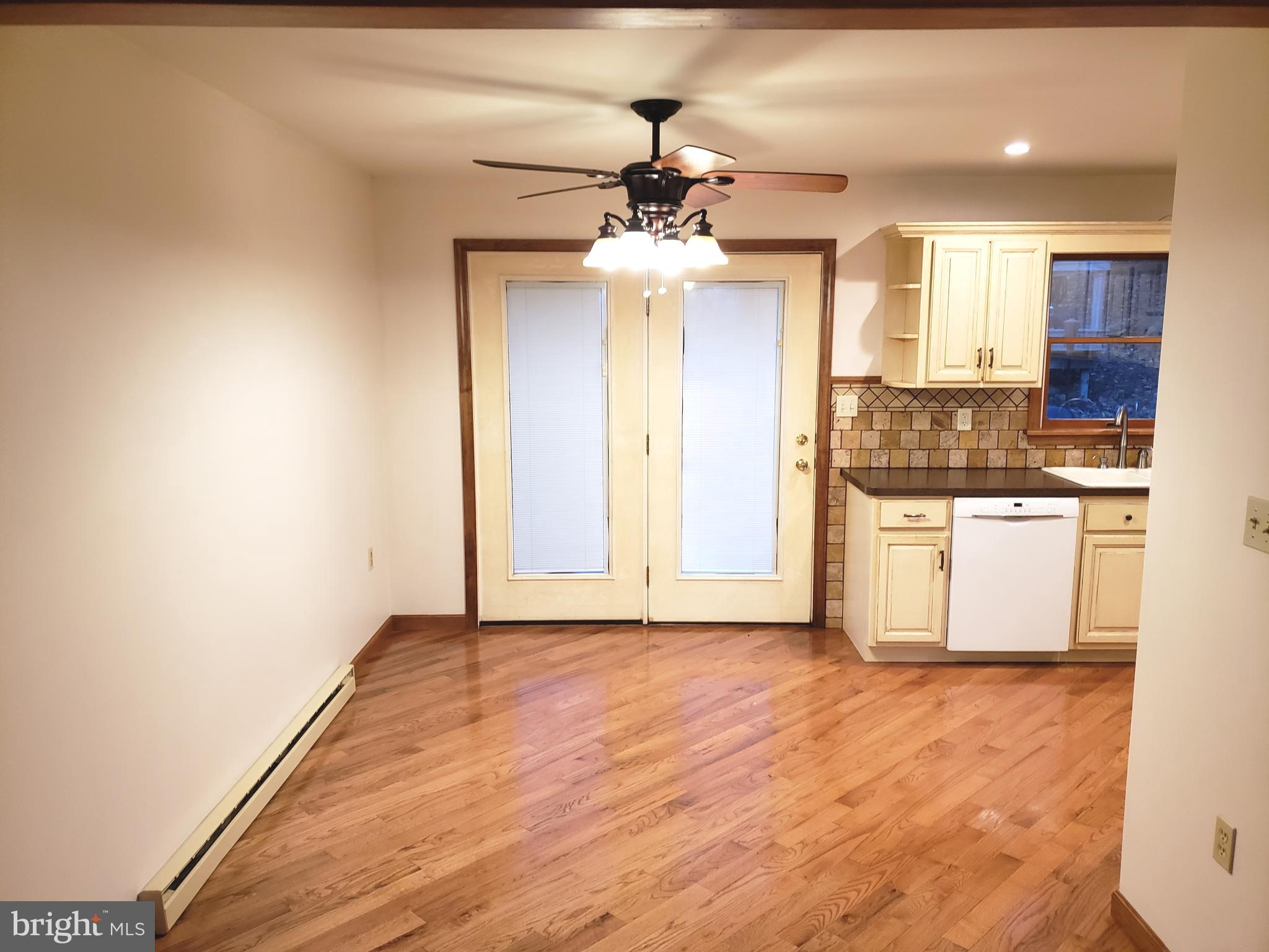 450 Church Lane Road Reading, PA 19606 - Photo 7 of 16 Refinished hardwood dining room, atrium to decks