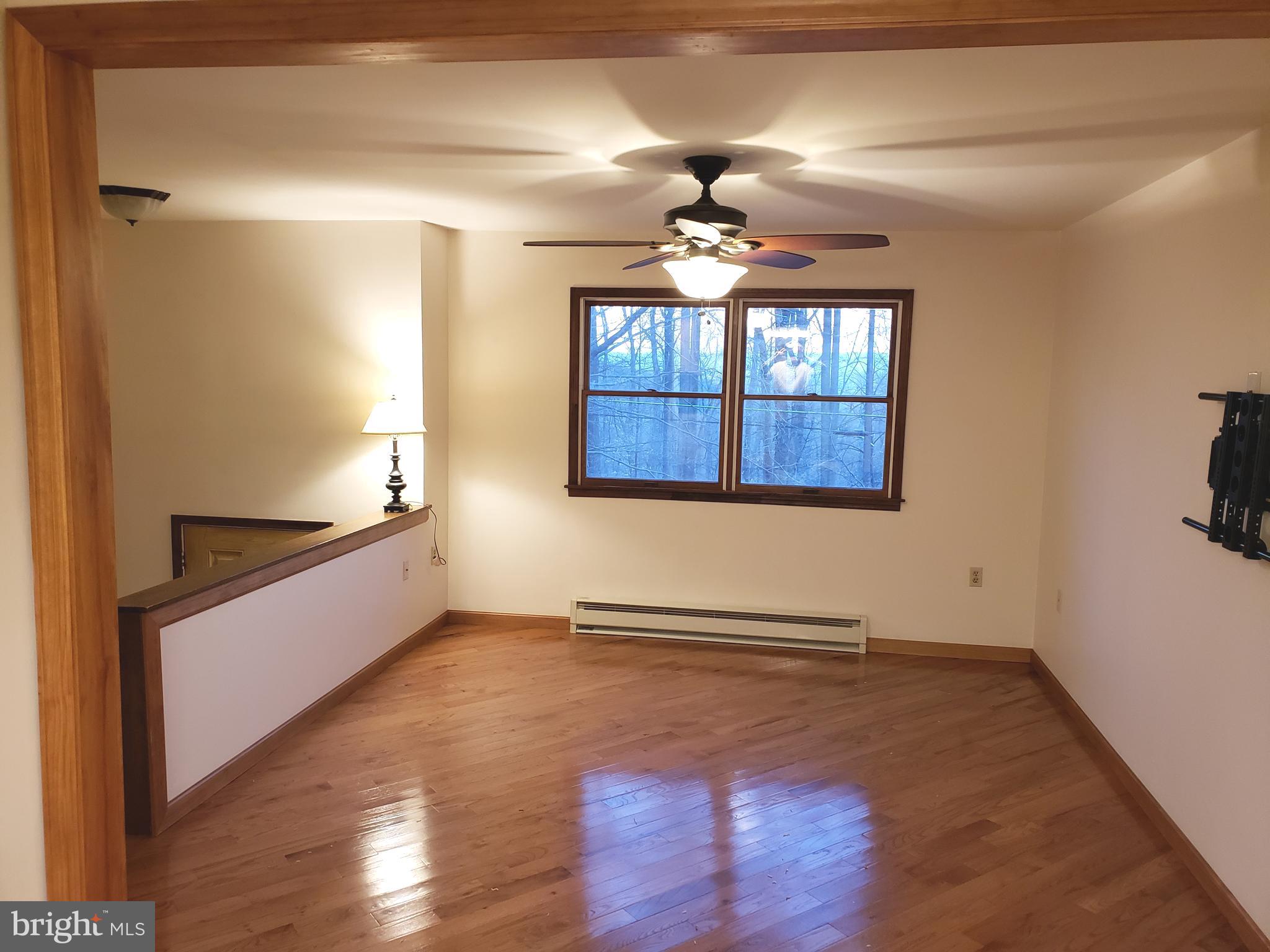 450 Church Lane Road Reading, PA 19606 - Photo 8 of 16 Beautiful hardwood refinished floor living room
