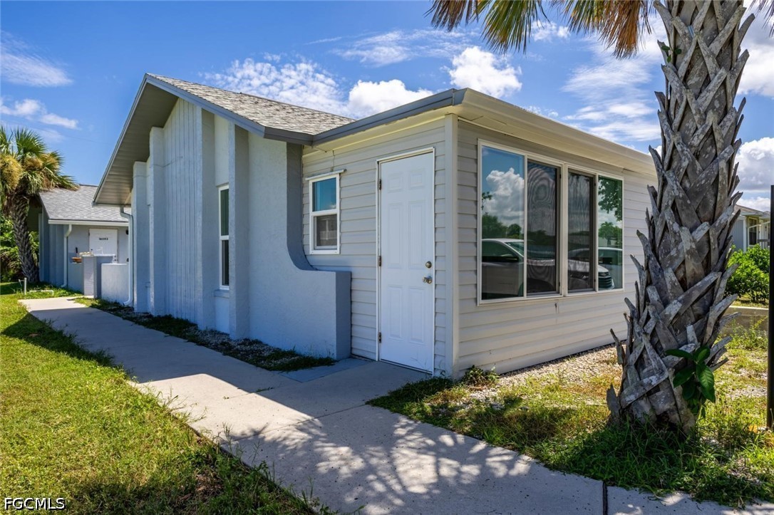 16595 Davis Road Fort Myers, FL 33908 - Photo 2 of 31 a view of a house with a yard