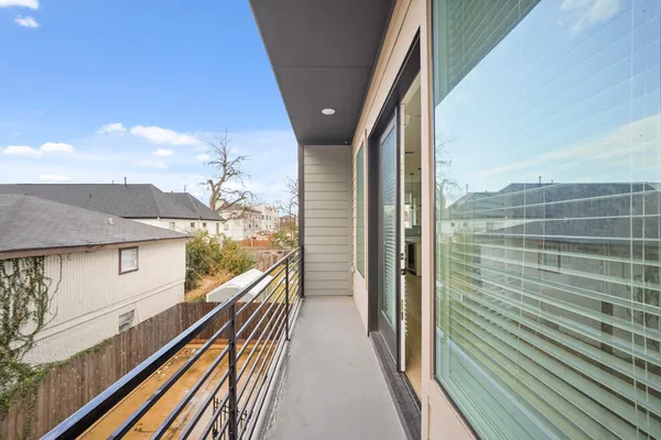 a view of balcony with furniture