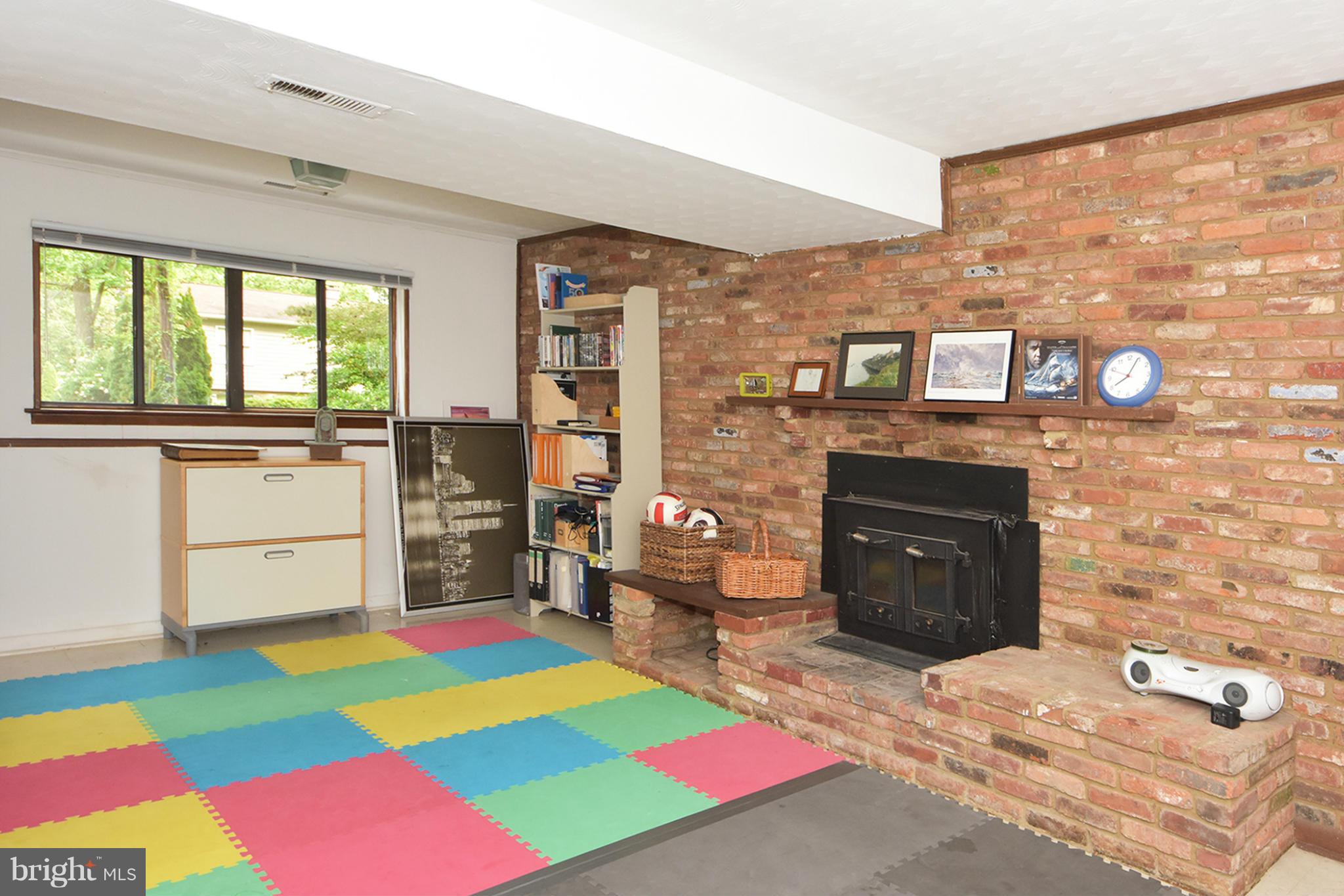 2994 Valley View Road Annapolis, MD 21401 - Photo 20 of 28 Lower level family room has a wood stove