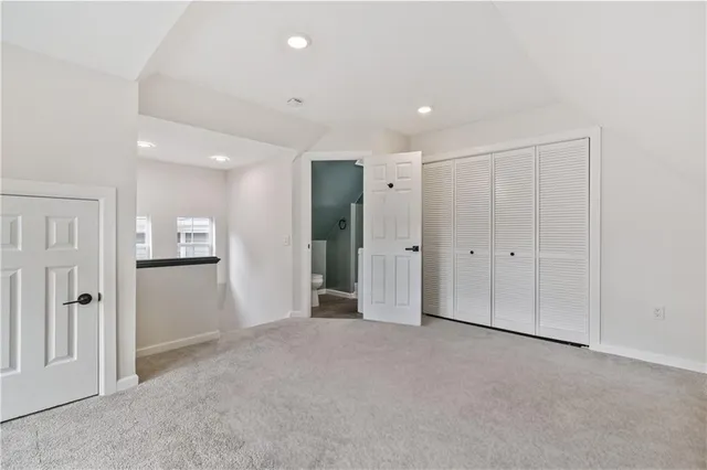 a white toilet sitting next to a bathroom sink