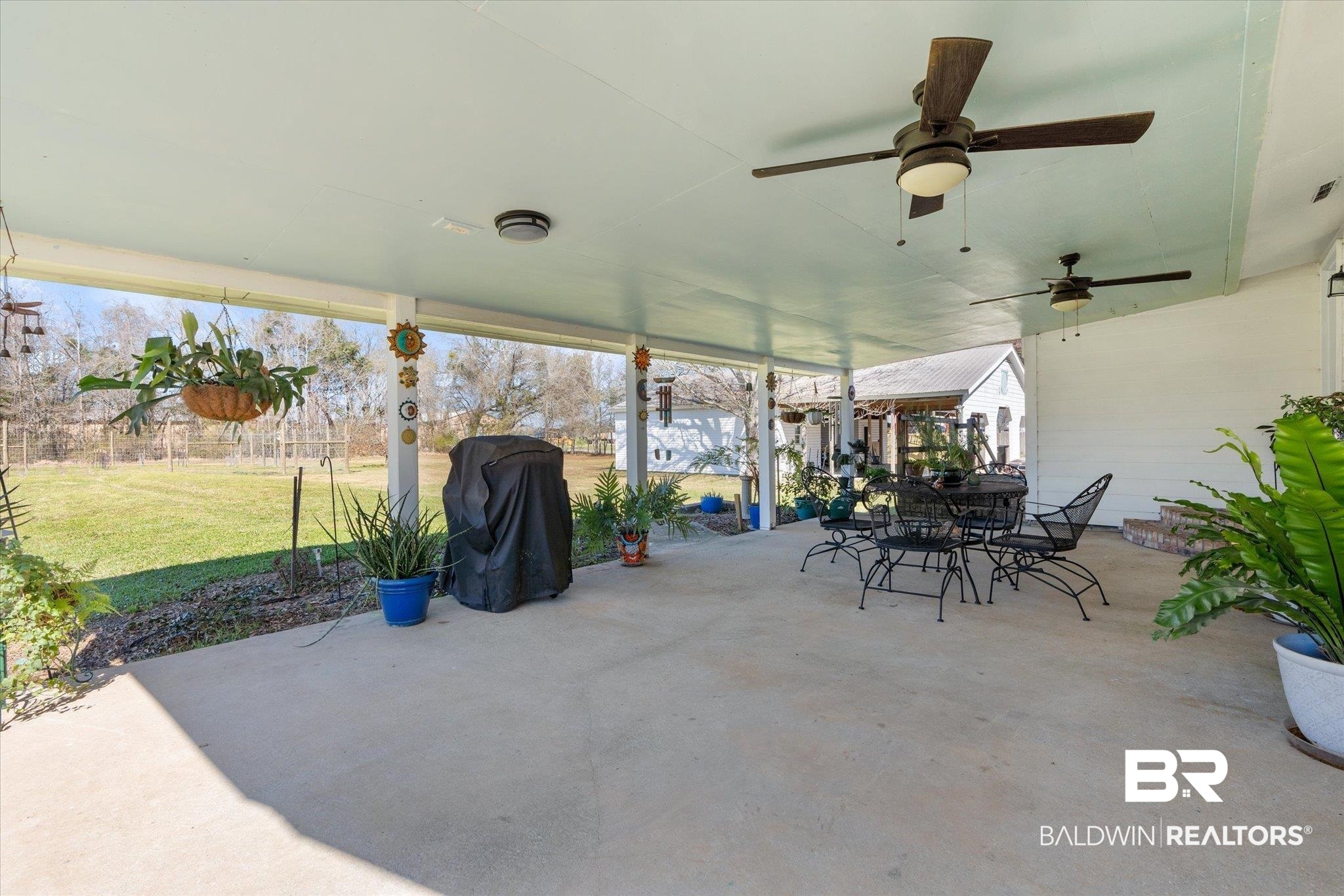 14280 Cat Deakle Road Grand Bay, AL 36541 - Photo 27 of 51 View of patio / terrace featuring a ceiling fan and outdoor dining space