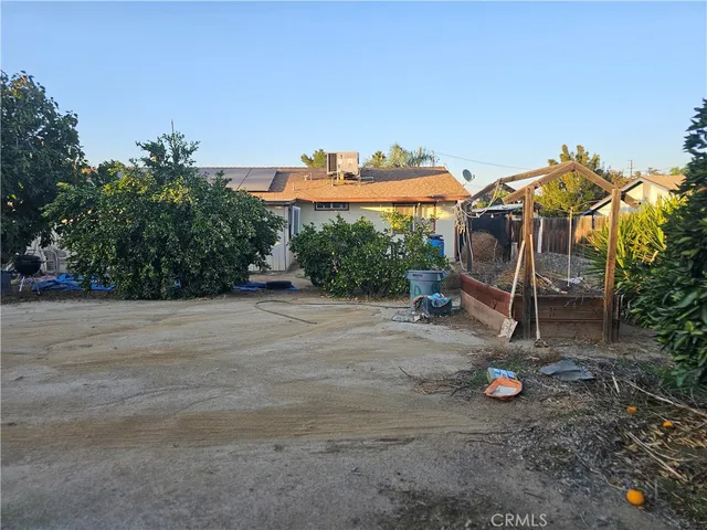 a view of a basketball area with potted plants