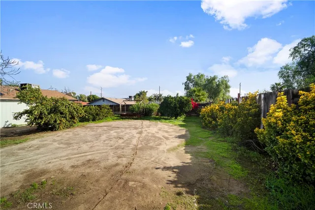 a view of a street with a building in the background