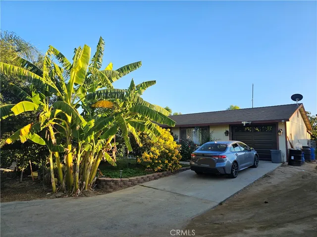 a house view with a garden space