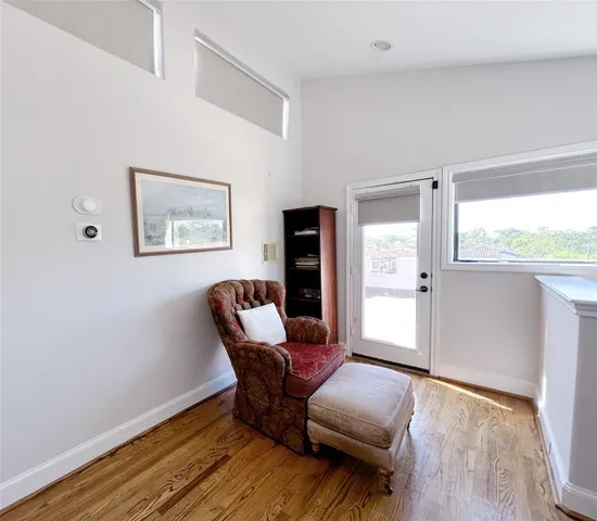 a view of room with furniture and wooden floor