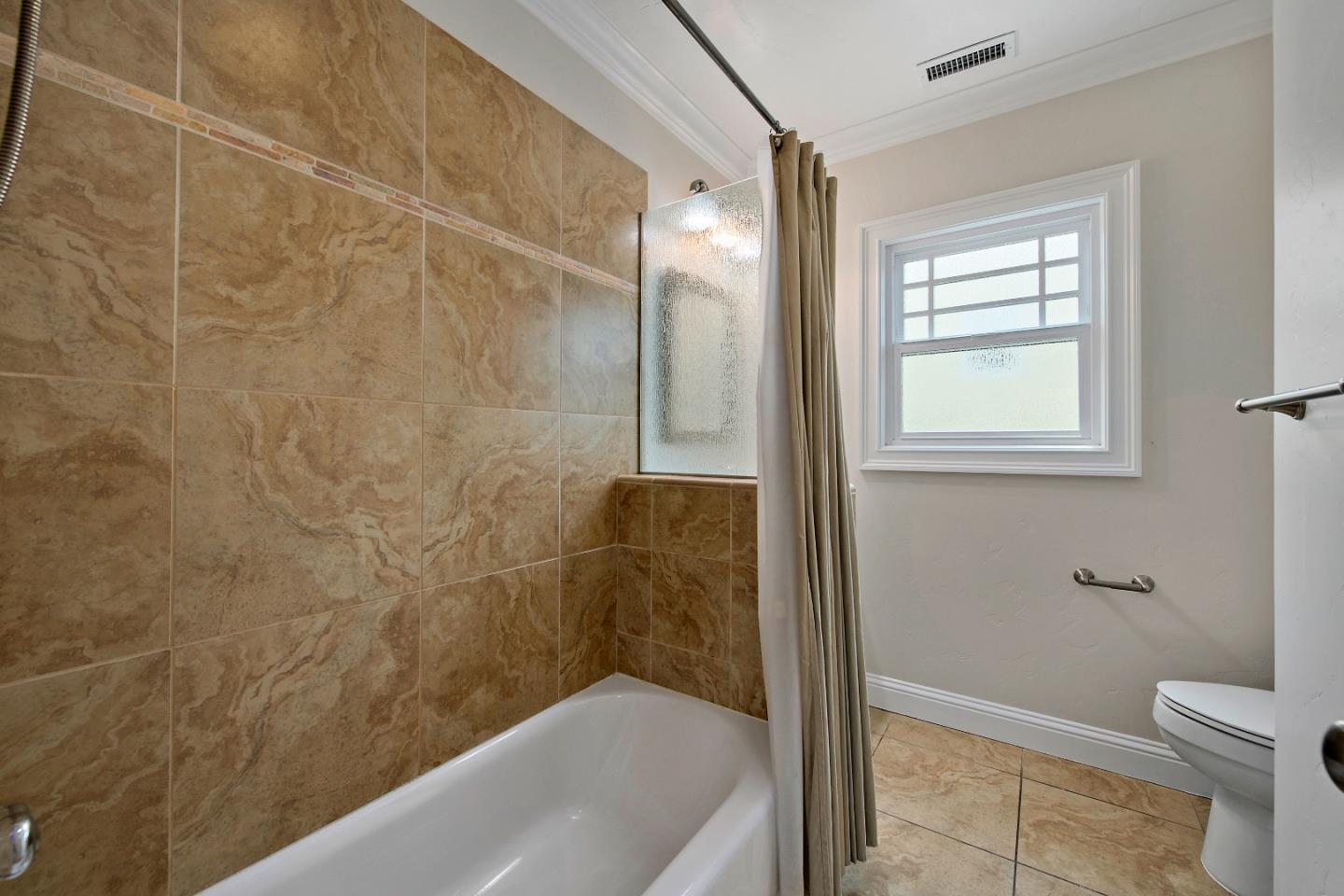 682 Second Avenue Redwood City, CA 94063 - Photo 13 of 18 a bathroom with a bathtub and a shower