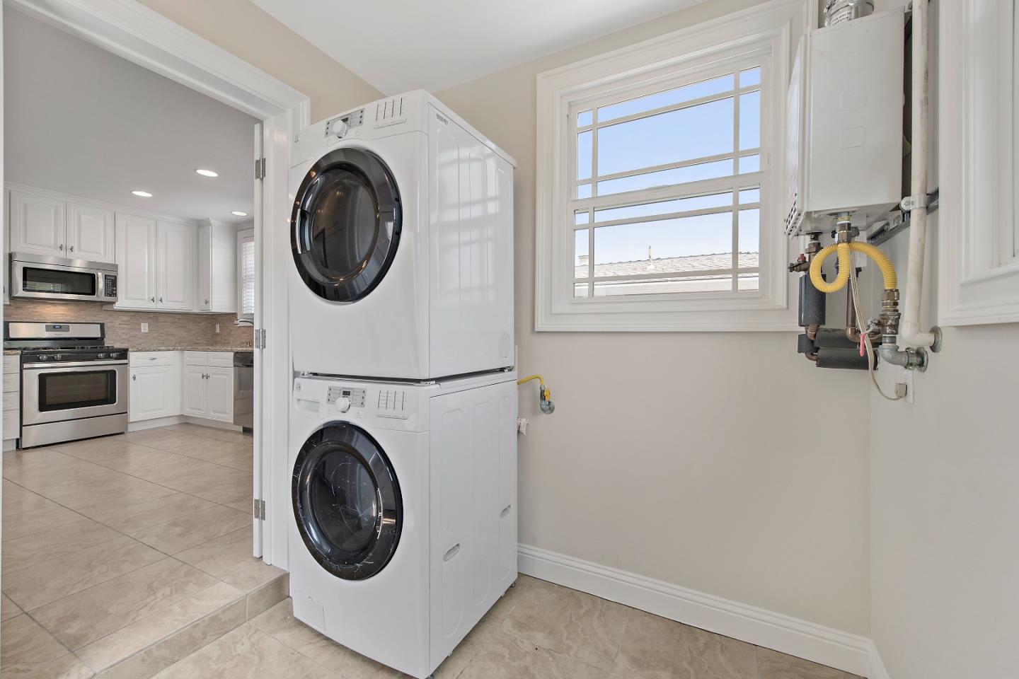682 Second Avenue Redwood City, CA 94063 - Photo 15 of 18 a view of a storage and utility room with washer and dryer