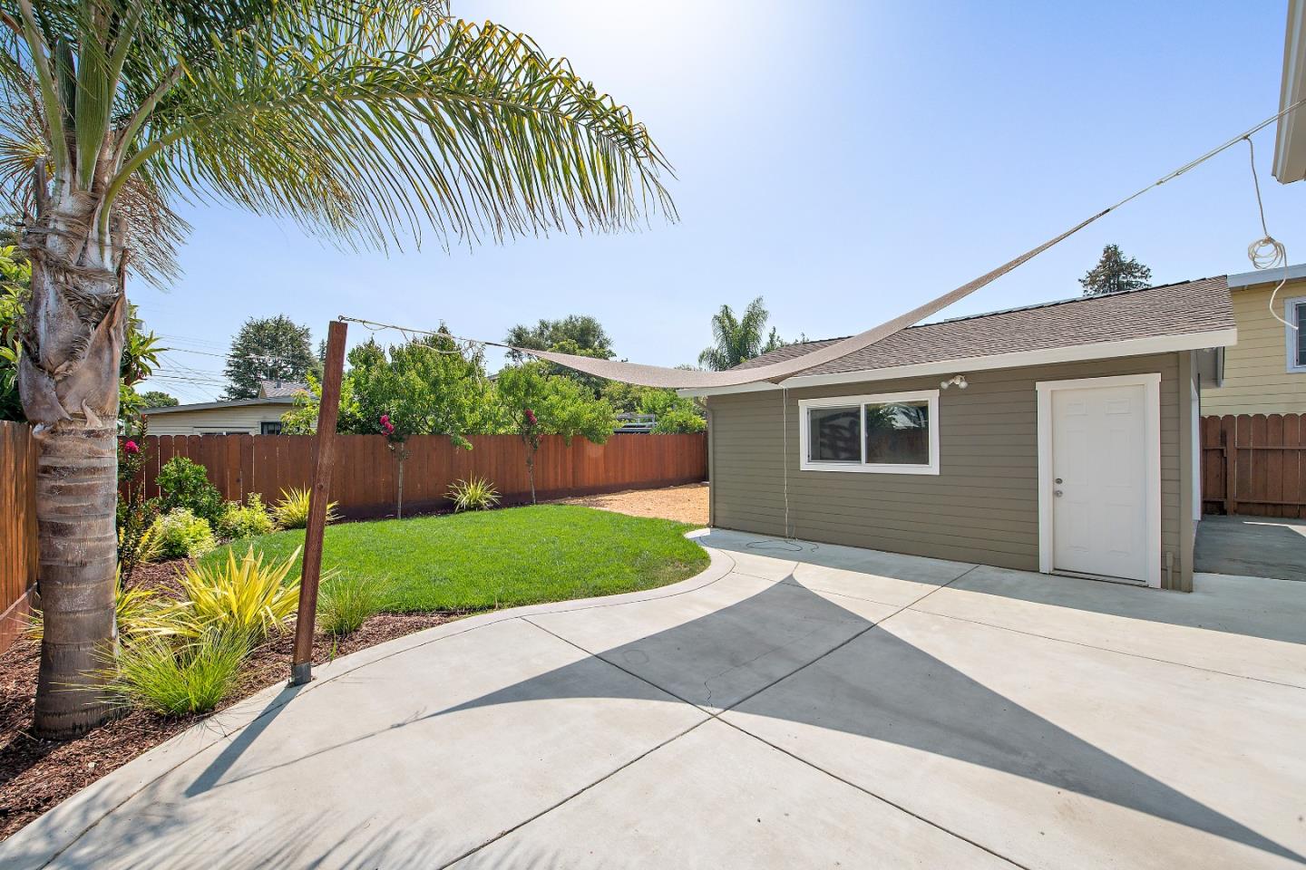 682 Second Avenue Redwood City, CA 94063 - Photo 16 of 18 a front view of a house with a yard and garage