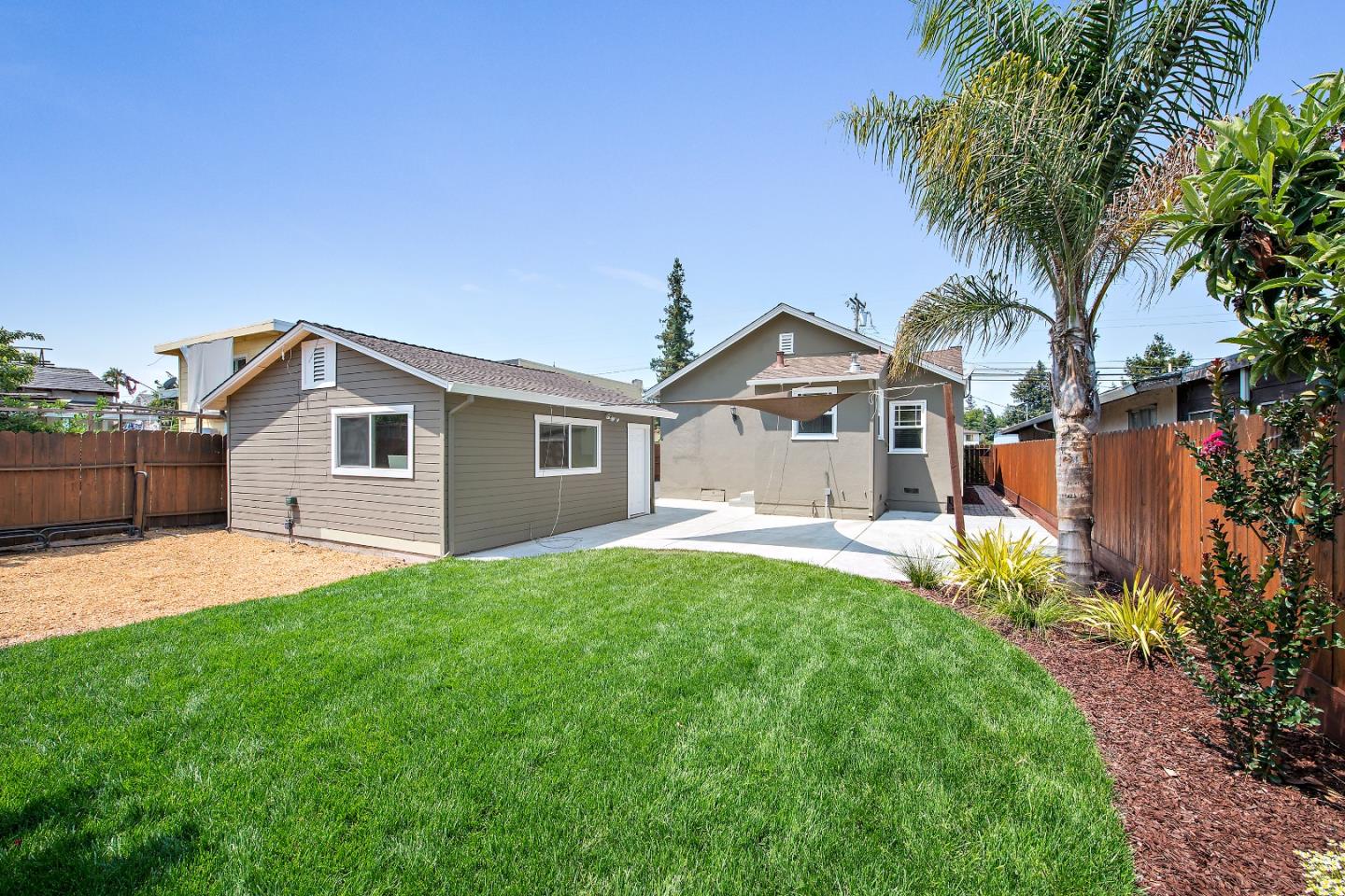 682 Second Avenue Redwood City, CA 94063 - Photo 17 of 18 a front view of house with yard and trees in the background