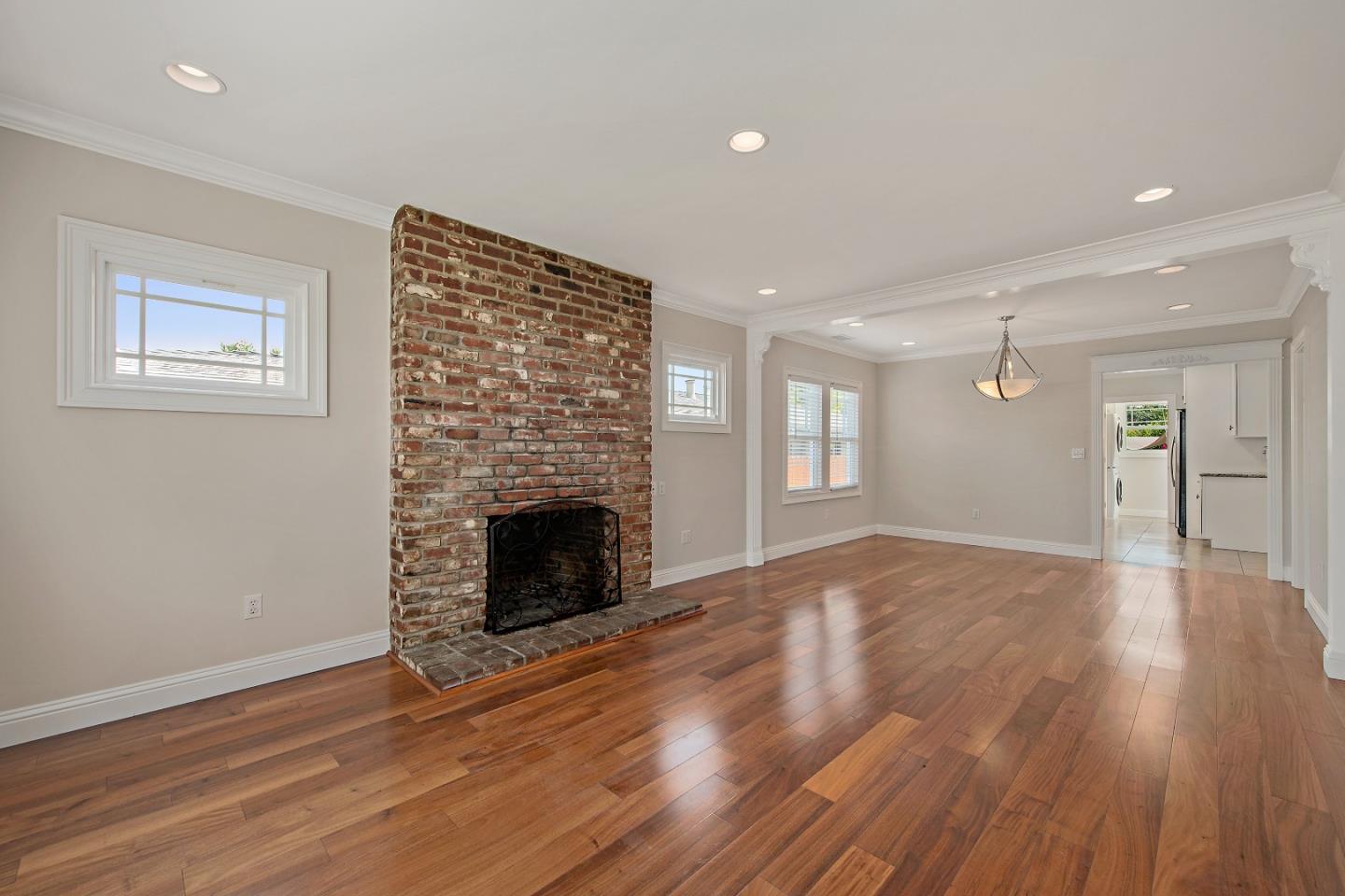 682 Second Avenue Redwood City, CA 94063 - Photo 6 of 18 a view of an empty room with wooden floor fireplace and a window