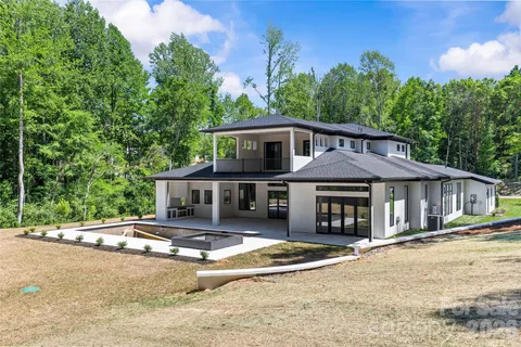front view of a house with a swimming pool
