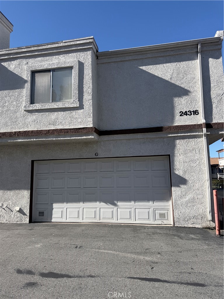 a kitchen with a sink and a microwave